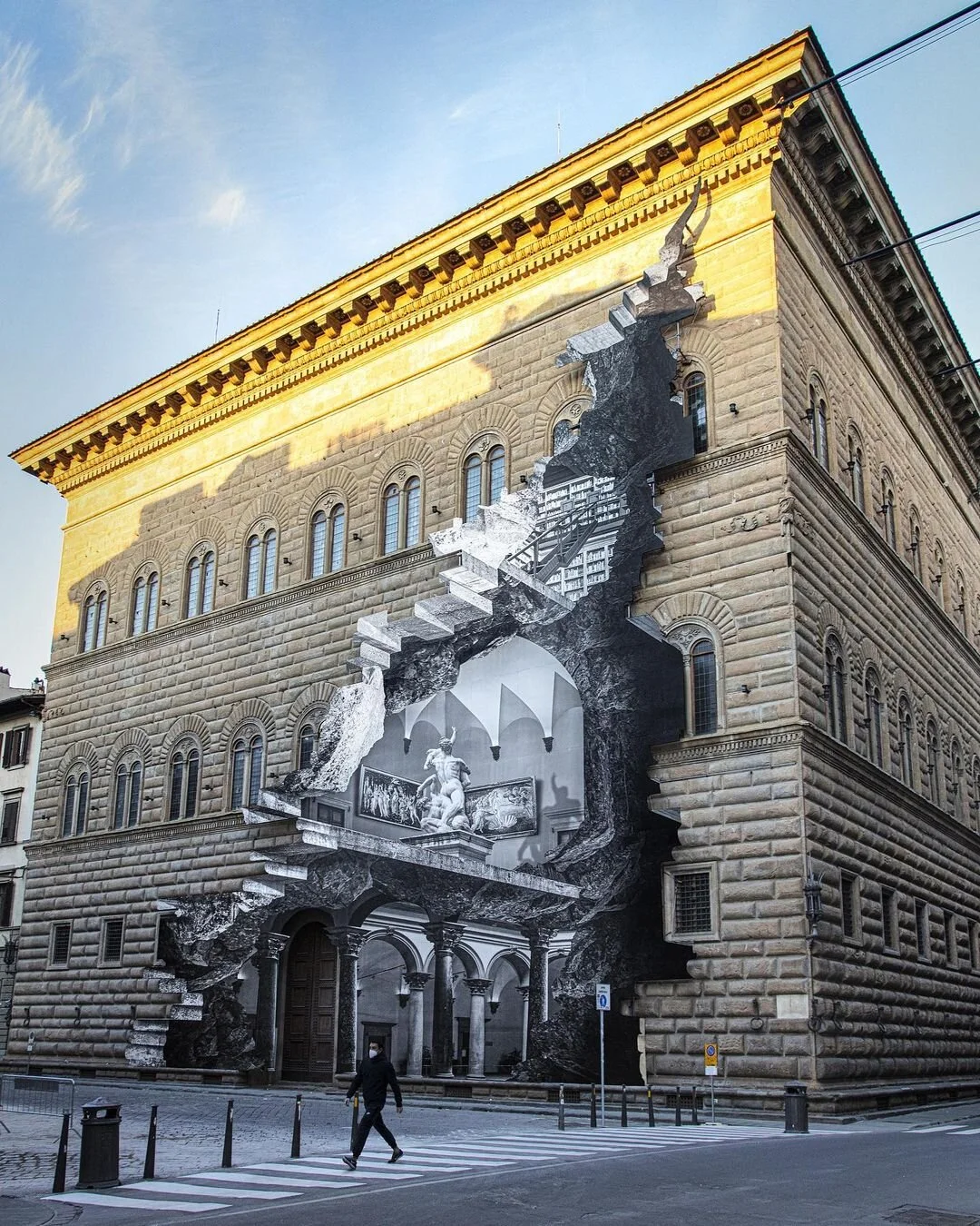 Street artist JR reveals "The Wound" in Florence