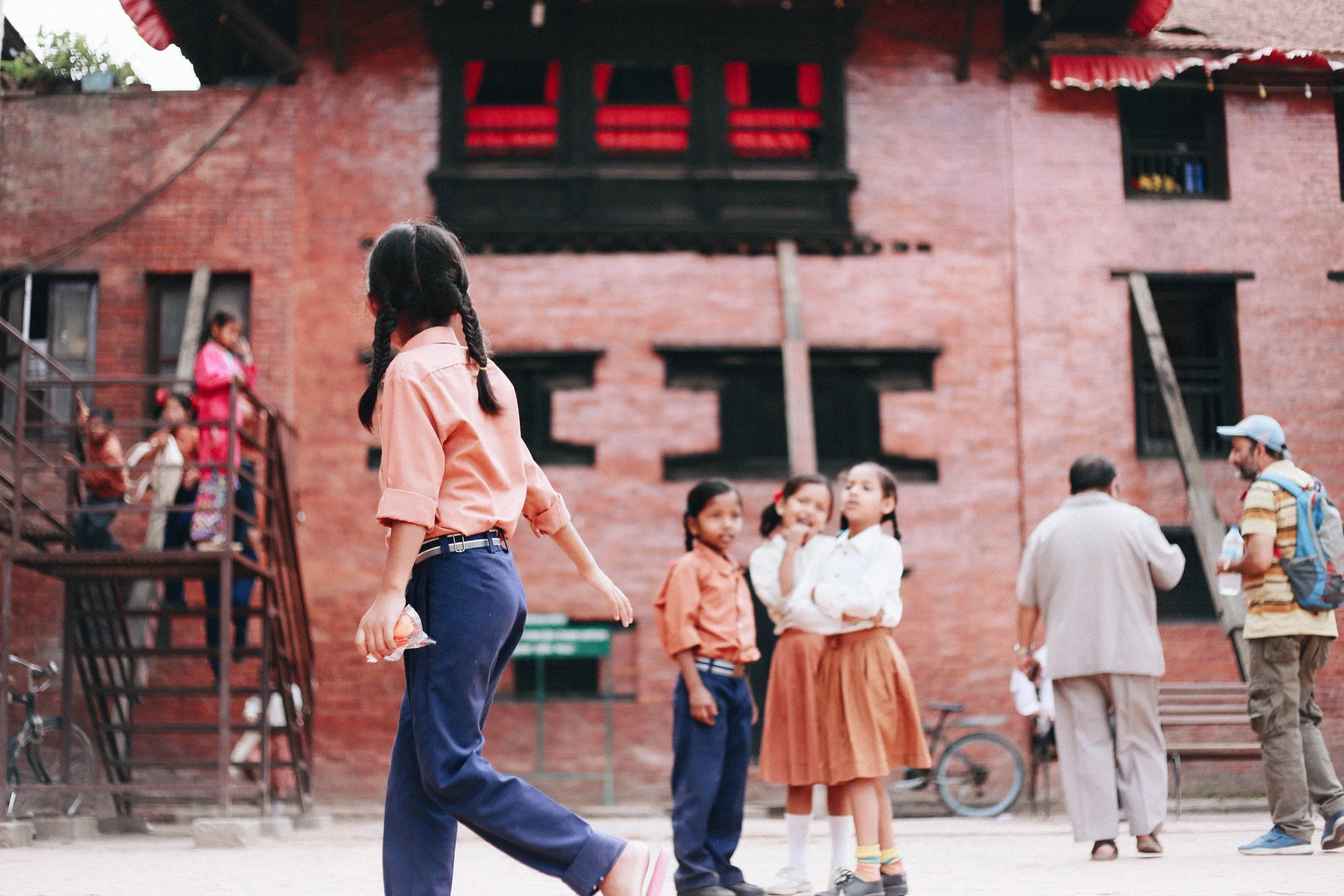 9.Kumari Palace is opposite the school. 13.While many girls dream to be a goddess, kumari dream to be a normal kid, watching her peers from her window.jpg