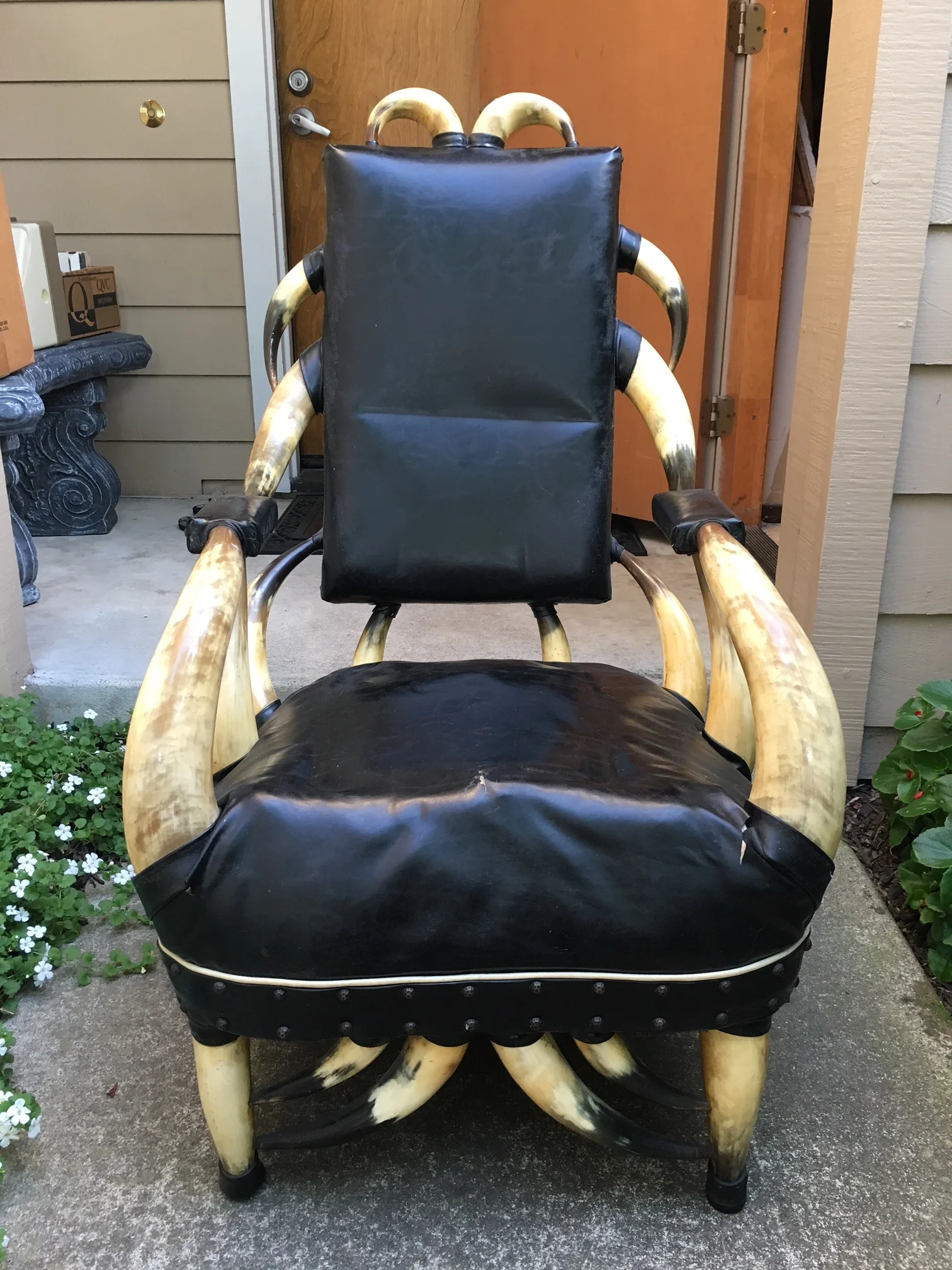 This steer horn chair is missing one of its 24 horns, lowering its value to collectors
