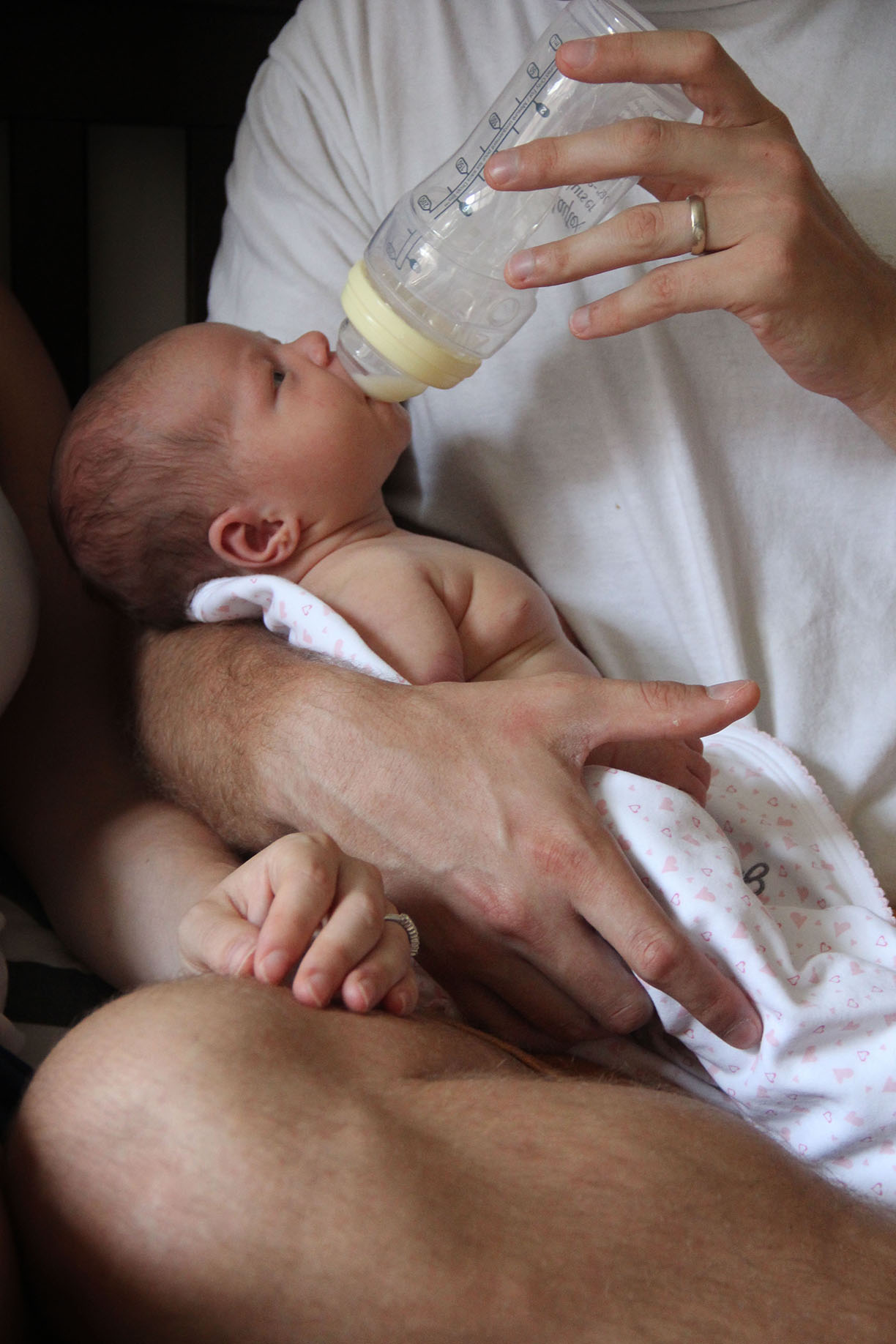 Father feeding newborn.jpg