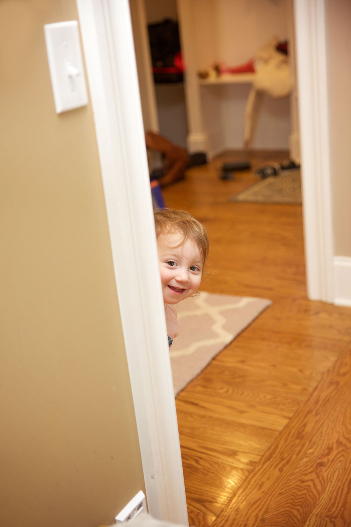 little girl peeking around the door.jpg