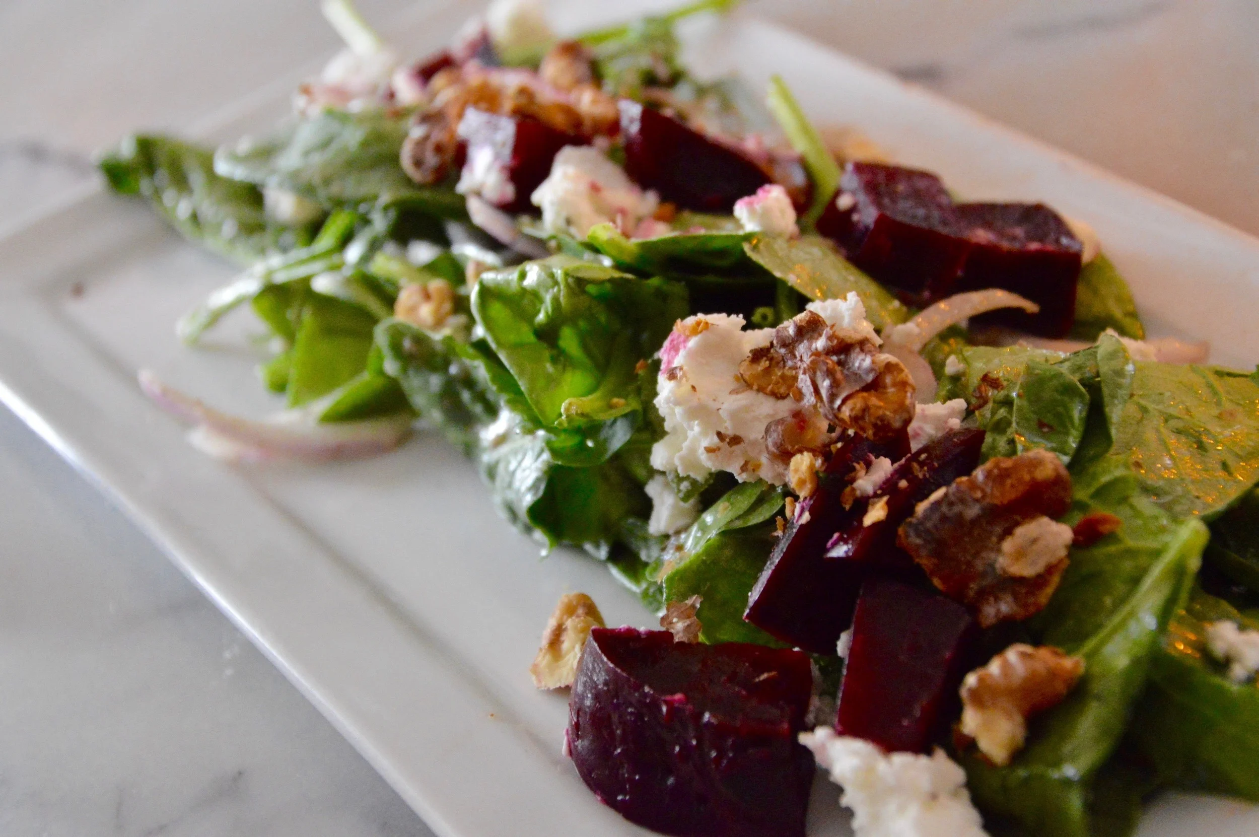 Roasted Beet Salad - Organic baby spinach, shaved red onion, herbed goat cheese, toasted walnuts, shallot vinaigrette