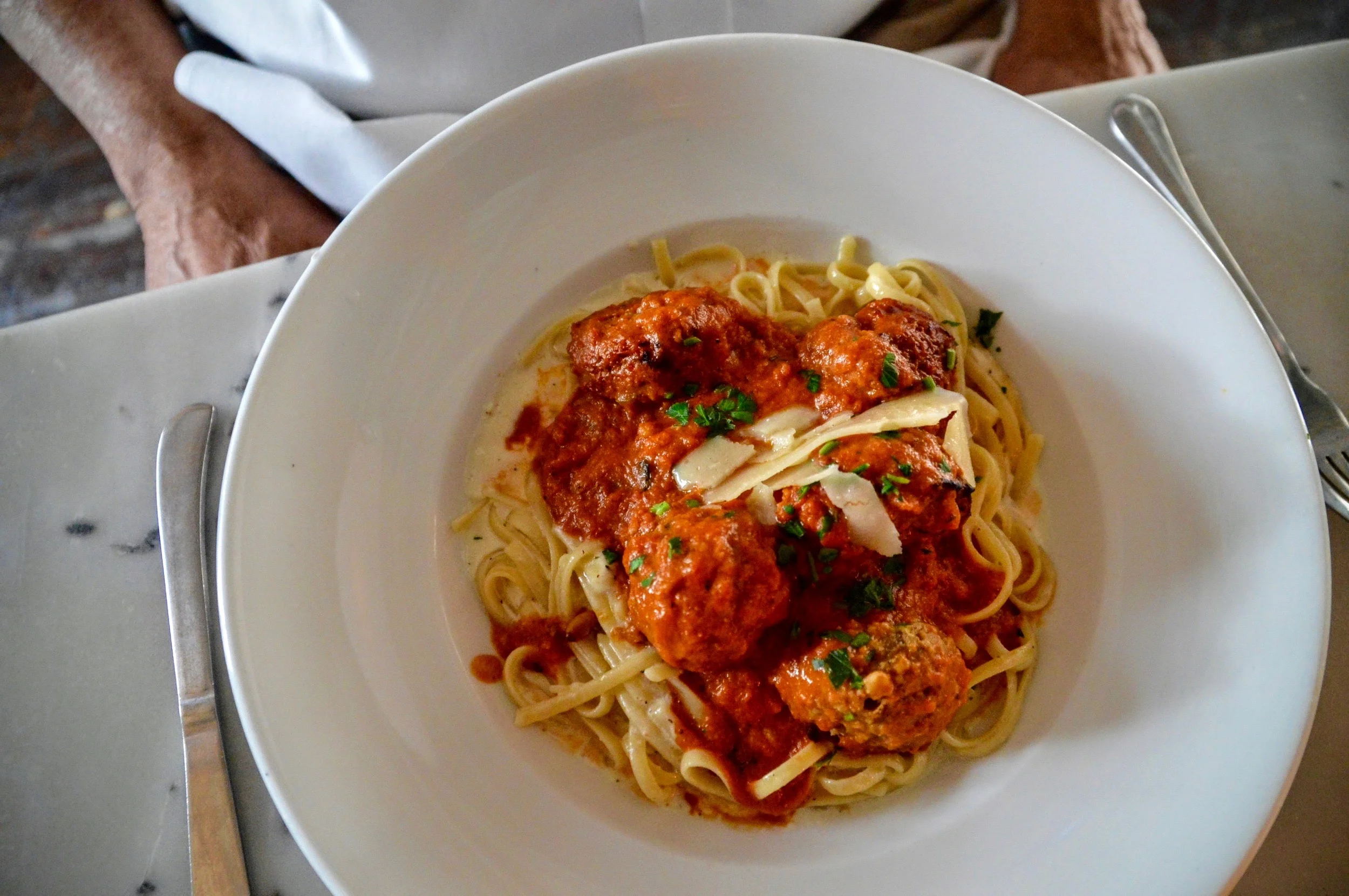 "Kobe" Beef Meatballs Pasta - Wagyu american beef, golden raisins, pine nuts, caramelized onions, white truffle cheese fondue, pomodoro sauce, linguine, parmigiano, pecorino romano 