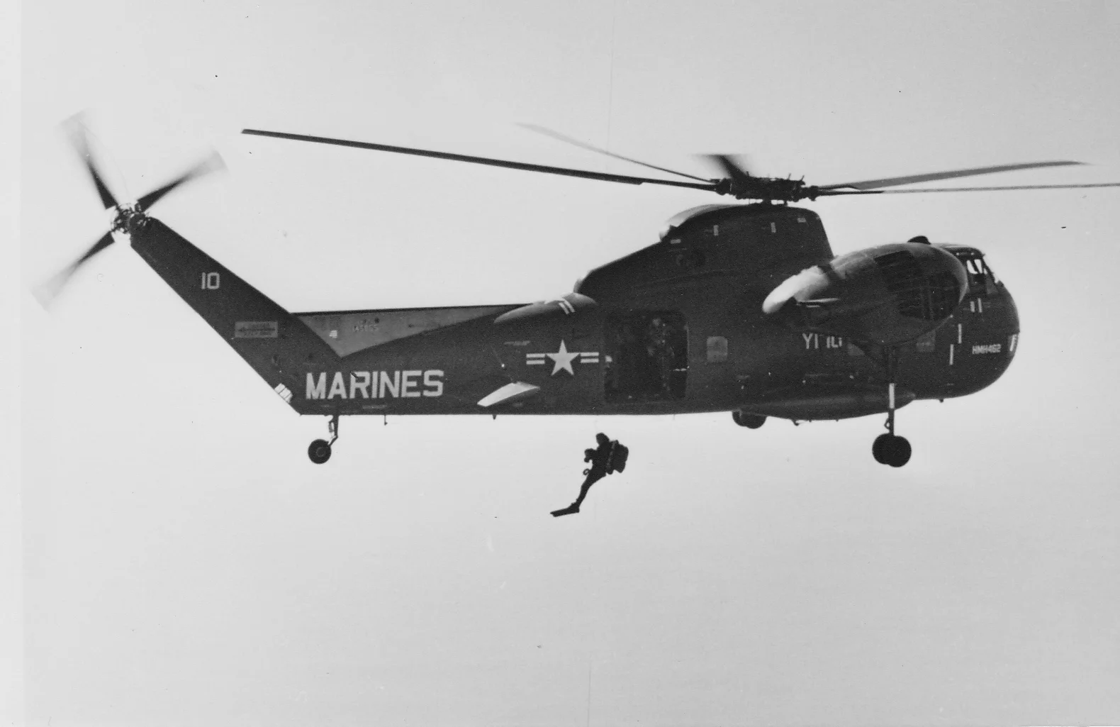 Jumping from the helicopter, in full dive gear, during Marine Force Recon training.