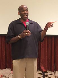 Carl speaking at a conference