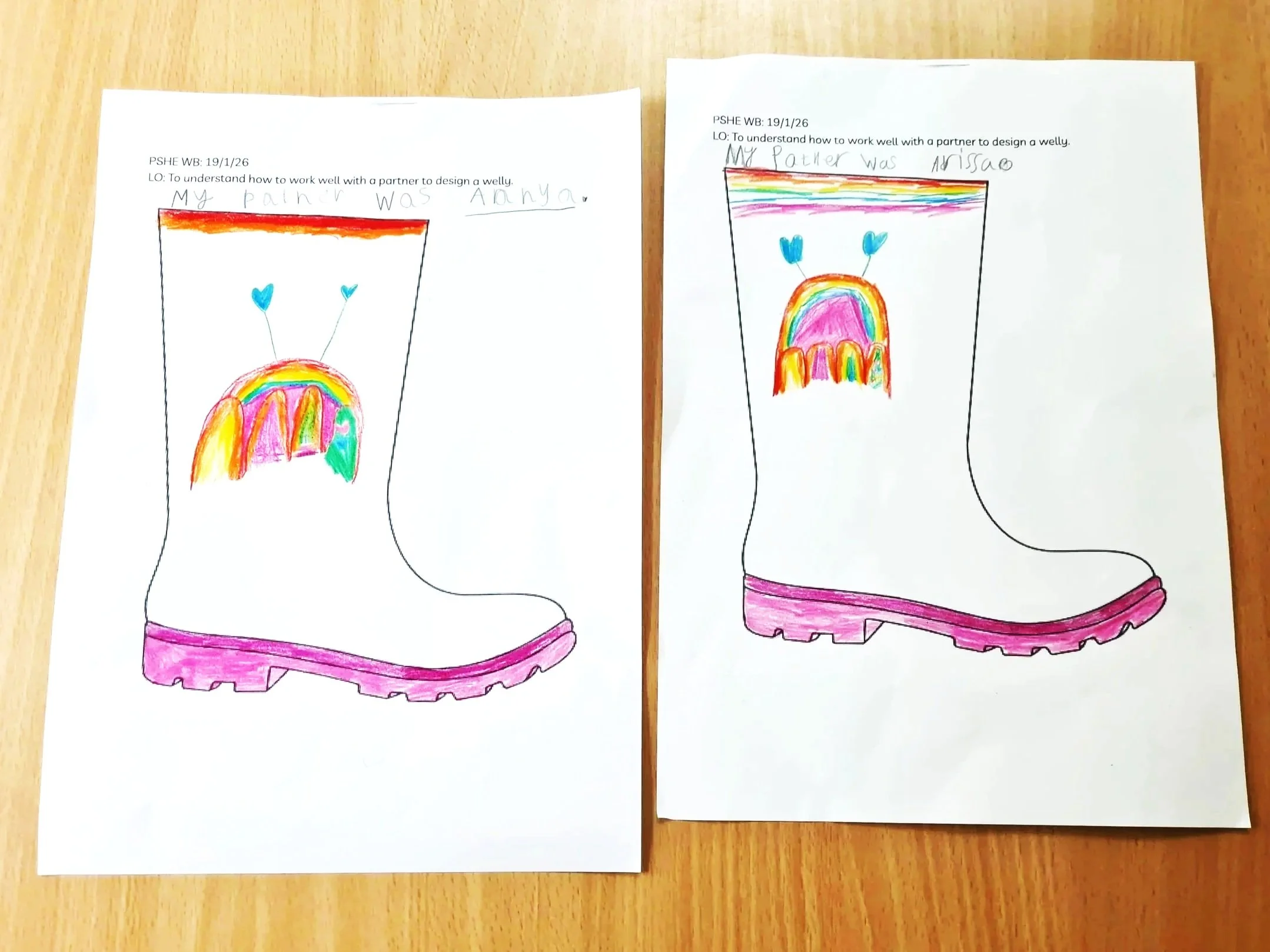 Two pieces of paper, each with a welly boot outline, each coloured in with a similar design to the other