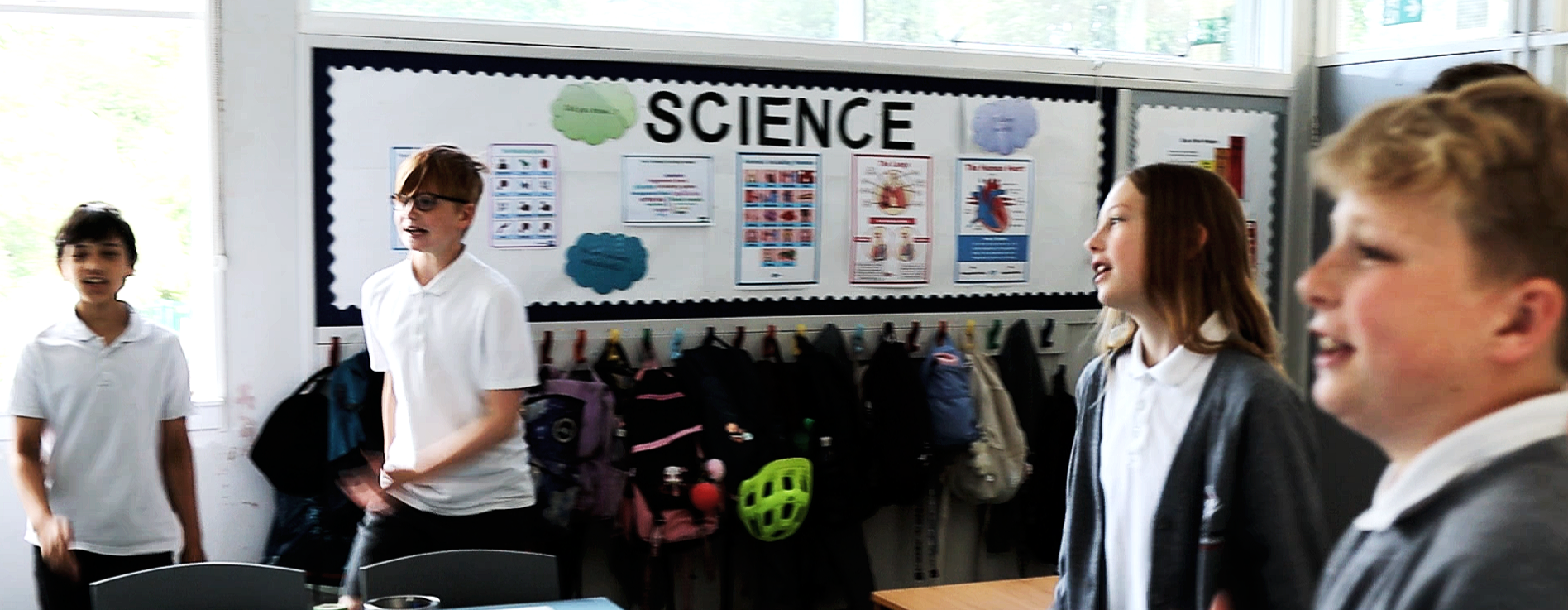 Pupils standing to chorally rehearse times tables