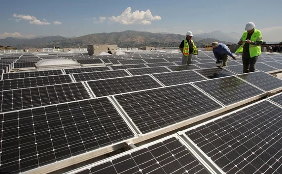 Solor panels and men.jpg