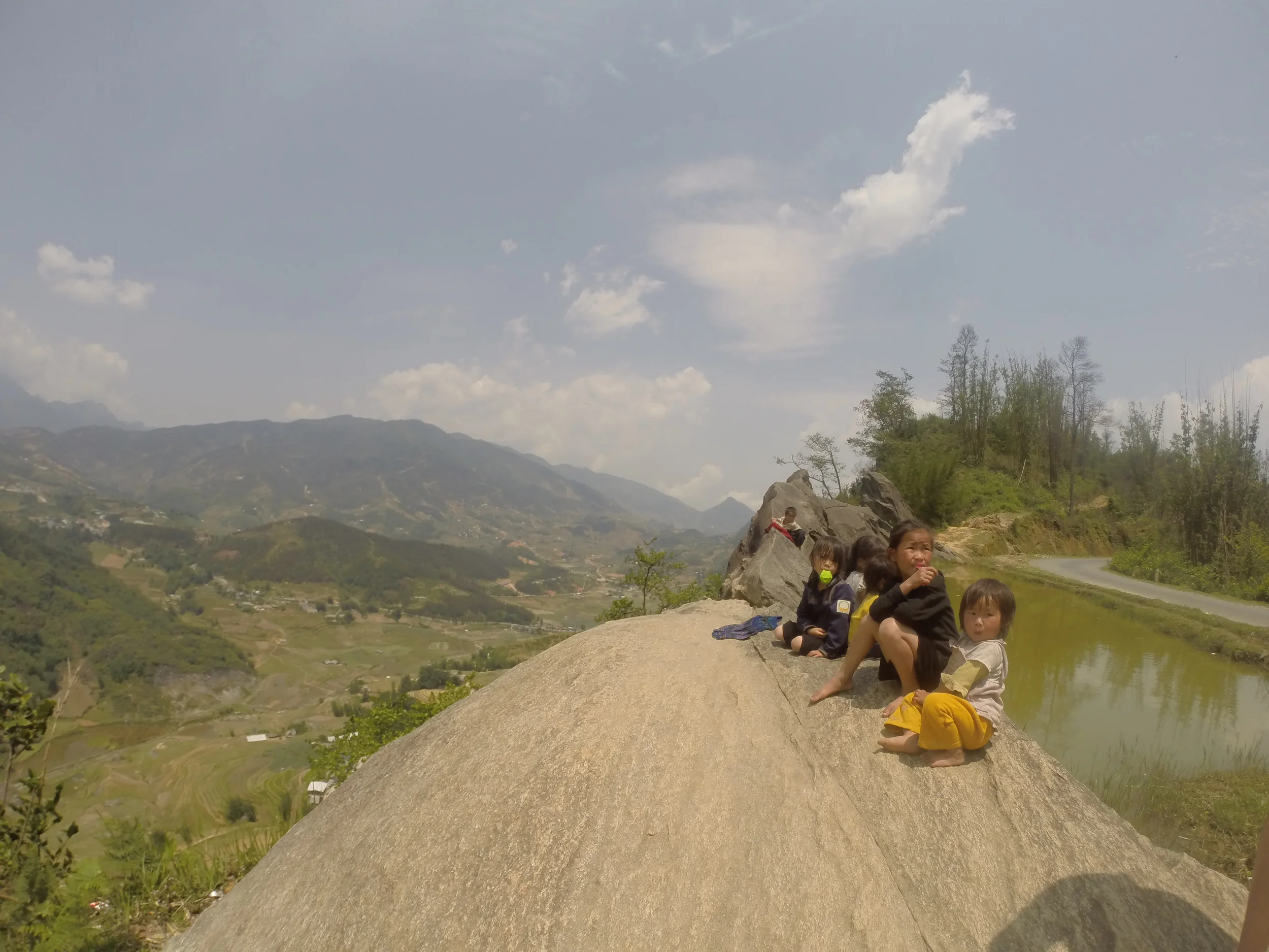 Kids playing unsupervised literally on the side of a cliff.