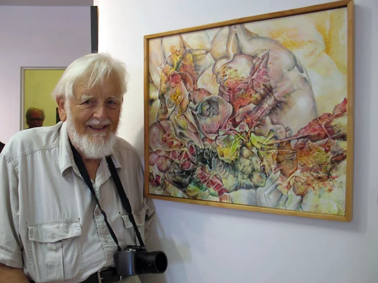 Artist Jan ten Broeke, a.k.a. Ten, with one of his many paintings