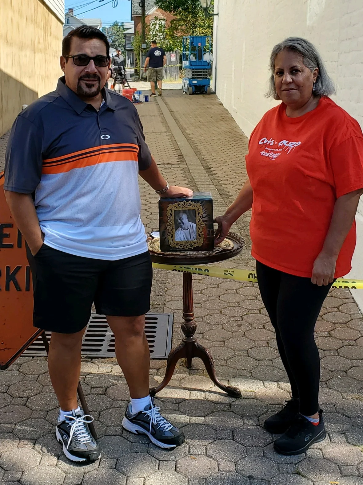 Jerome's parents, with his portrait