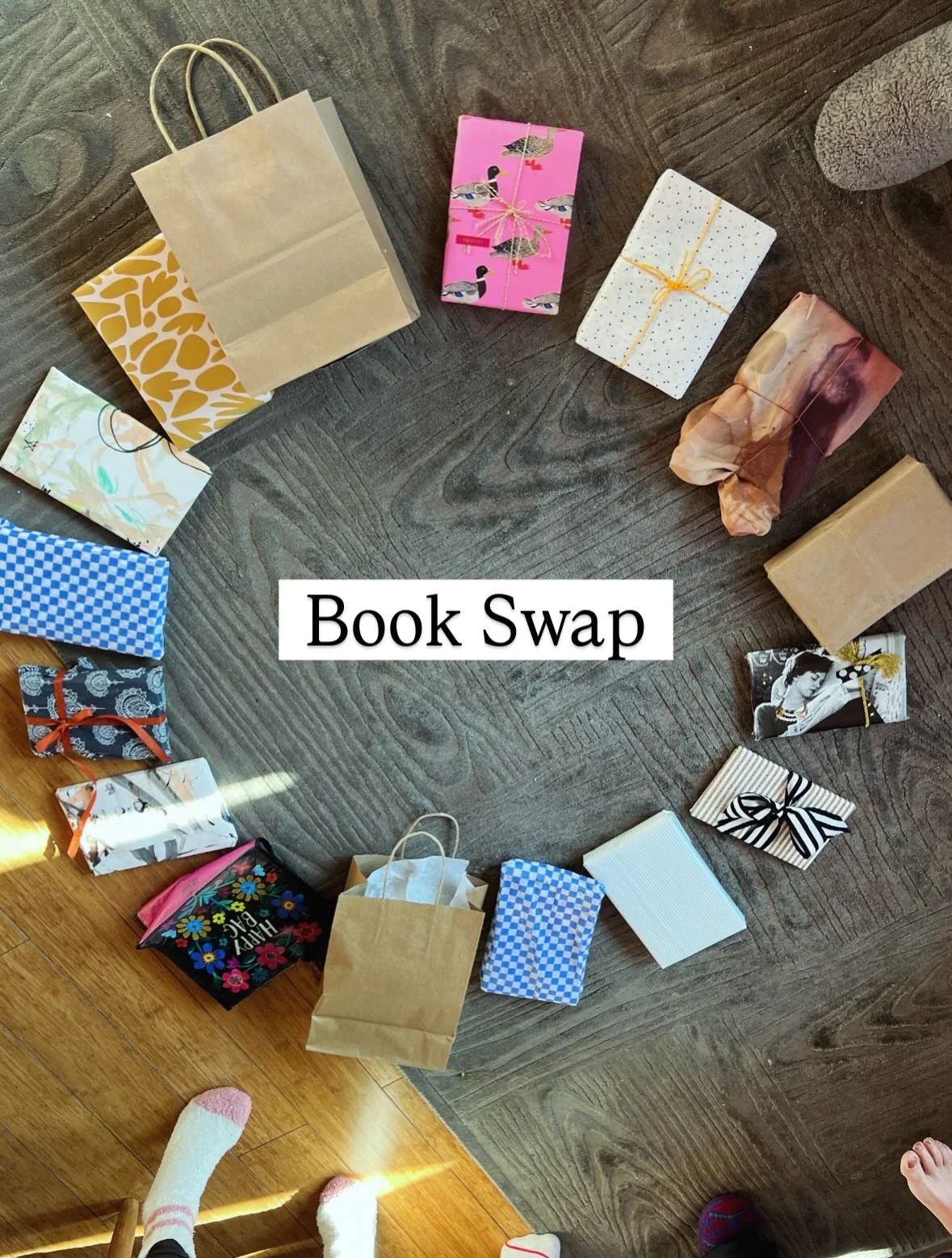 How to host the sweetest book swap ...

1) Host a gathering and request of everyone to bring a wrapped book 📕 📕 📕 
2) Place all the books in a circle add sunlight streaming through the windows and a warm beverage of choice. ☀️ 
3) One person picks