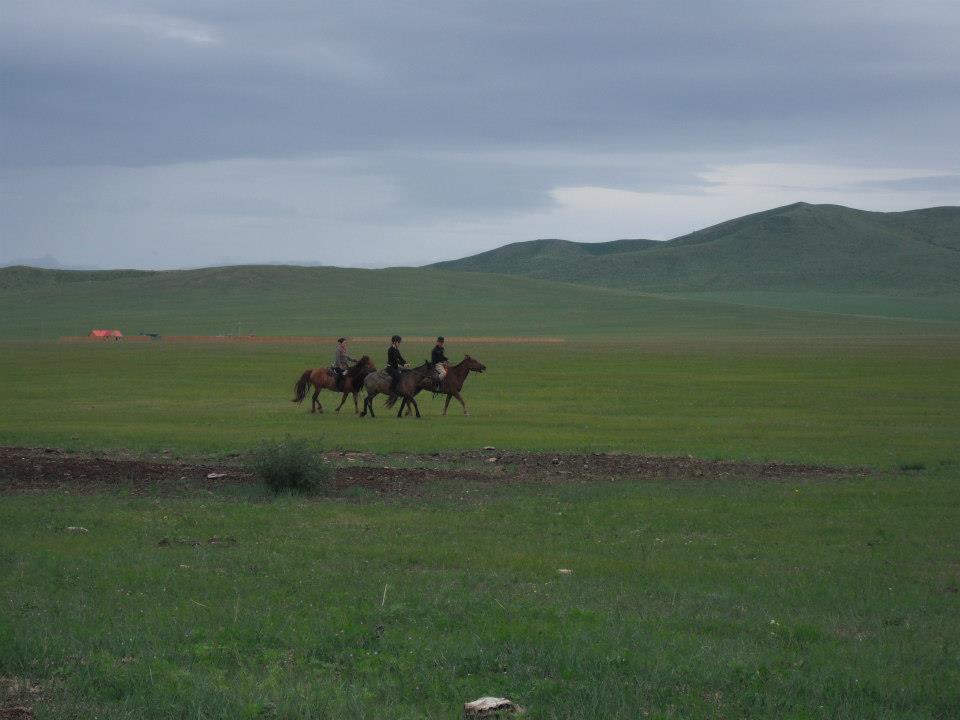 Natalka riding a horse while on holiday in Mongolia (2012) .