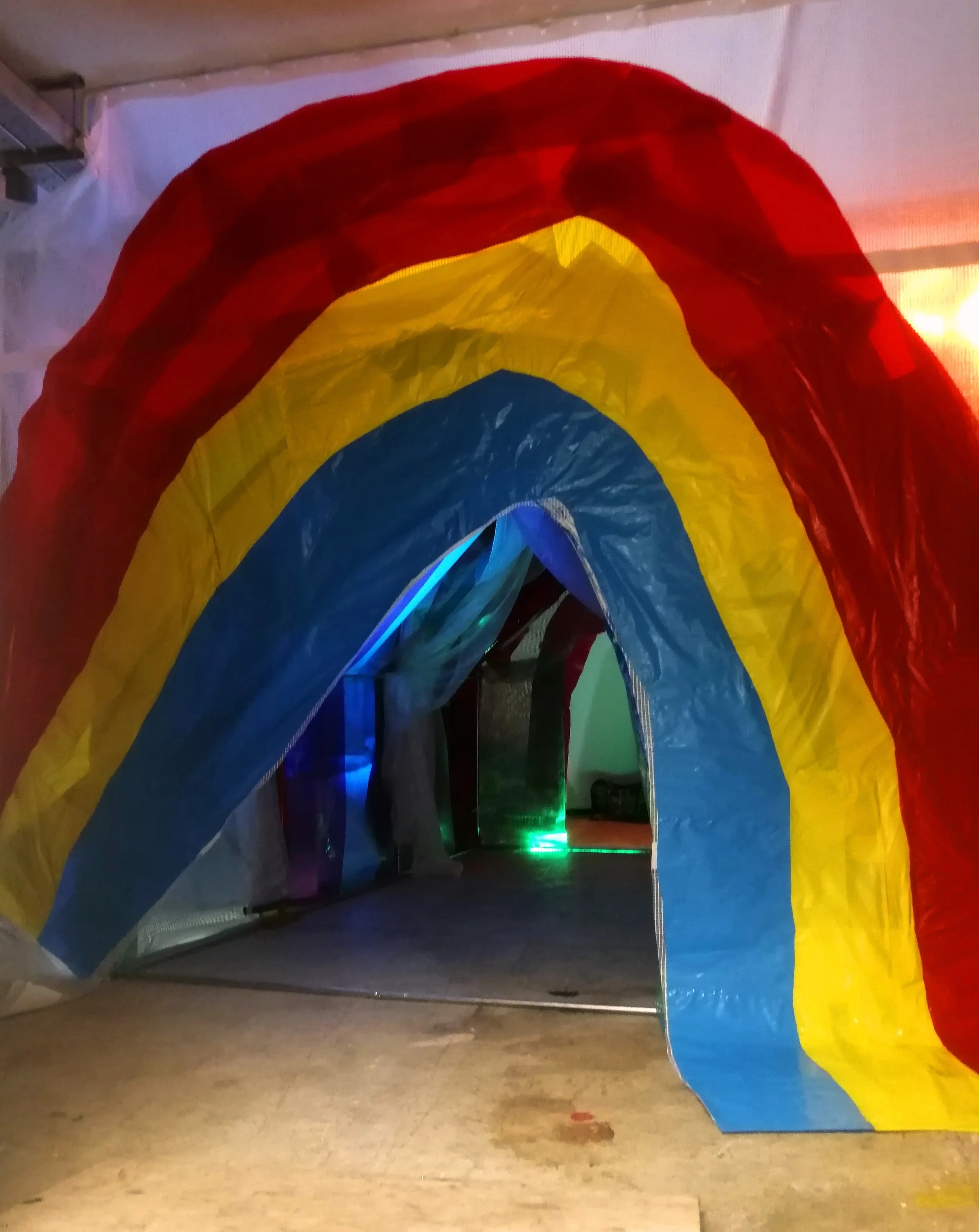 Who’s afraid of Red, Yellow and Blue?, rubble sacks, marker pen, scaffold sheeting, polytunnel and cover, various plastics, lightgels, lights, 2019, 300cm x 370cm x 410cm