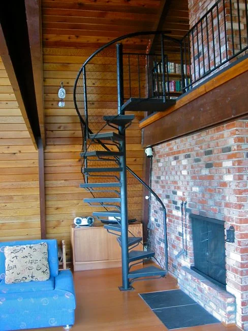 spiral stair leads to loft and two of the bedrooms