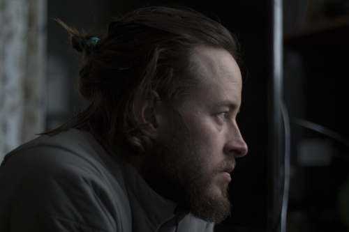 guy-looking-out-window.jpeg