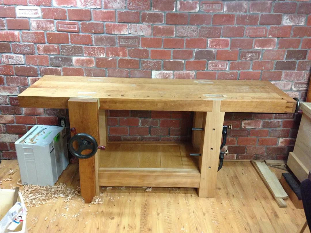 Quick shot of the new Roubo workbench with a coat of shellac on the shelf. Now I just need to finish the tool rack for the back and she’s done. Better pics coming soon… #condortails #madeinusa #madeinmichigan #Benchcrafted #woodshop #workshop #woodwork #handmade #cherry #beech #workbench #roubo #tenon #dovetail #legvise #wagonwheel #woodworking #mcmfurniture #lienielsen #whiteoak http://ift.tt/1MFp2Jy