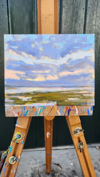 Marsh Sunset No. 24 on easel from a distance.jpg