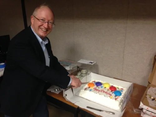 AGS celebrated its 50th Anniversary. President Jack Sharp cuts the cake at the May 2015 meeting.