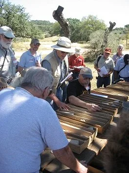 Dennis is seen with his characteristic interest looking over core at Hamilton Pool during an AGS field trip in 2007.