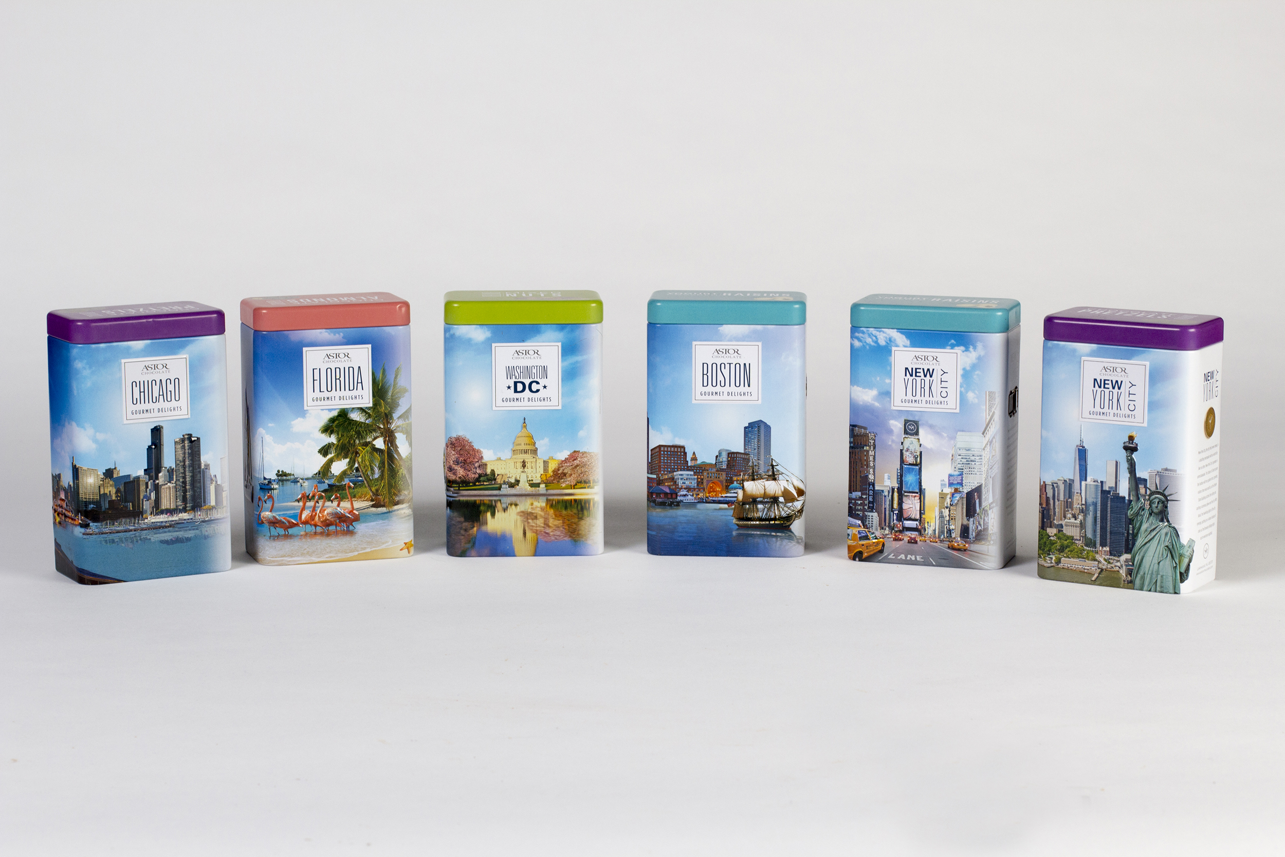 Complete redesign of a dated line of souvenir gourmet snack tins. 