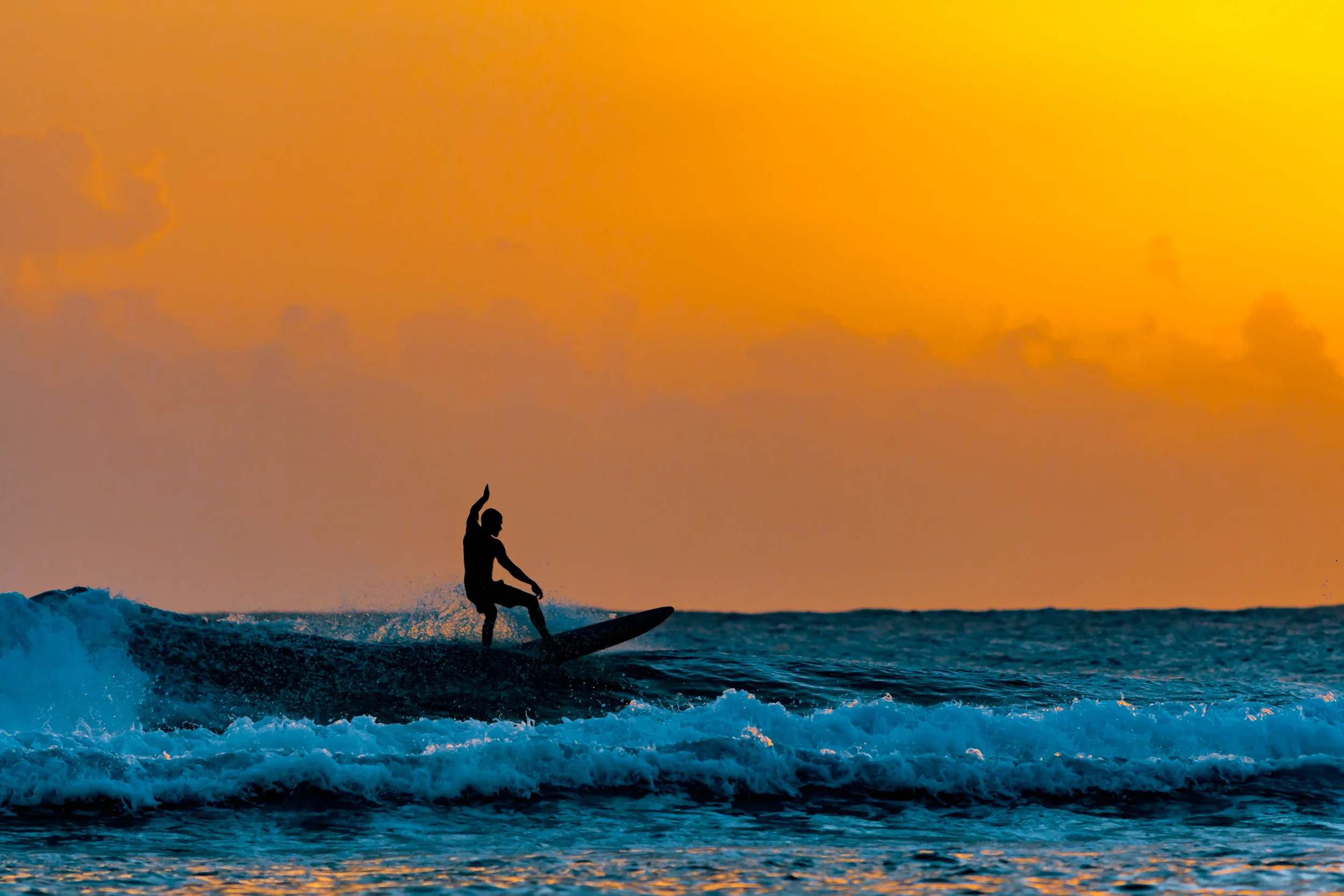 09 silhouette of surfer at sunset in the caribbean.jpg