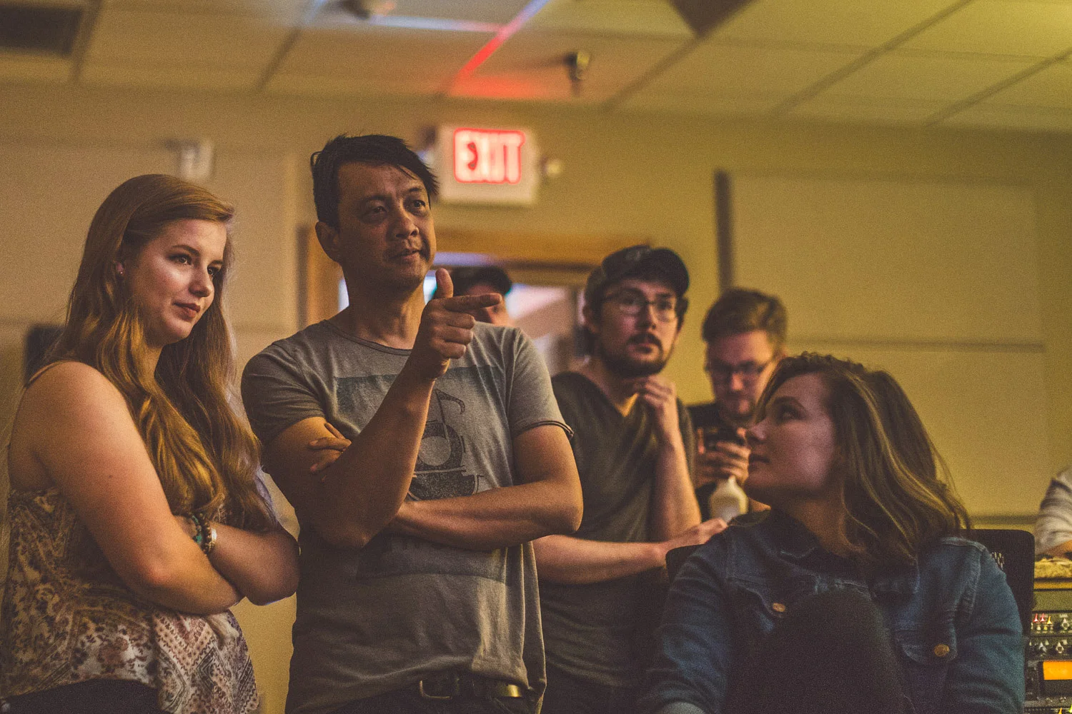 Students working through a song arrangement with Jerome Fontamillis of Switchfoot at the Songbirds’s Studio .
