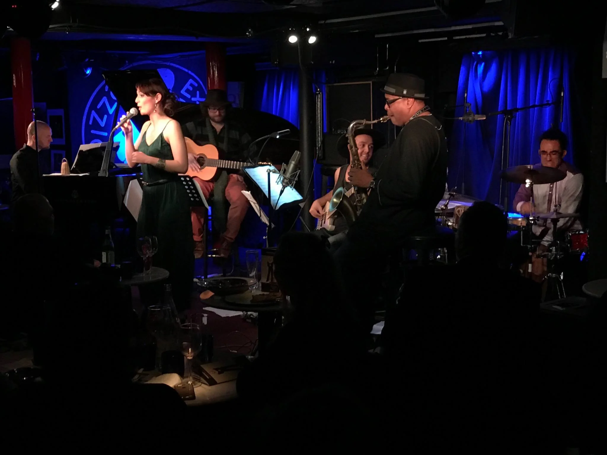 Pictured Left to Right: Liam Noble/piano, Noemi Nuti/vocals, Mario Bakuna/guitar, Moyses Dos Santos/bass, Jean Toussaint/saxes, Alua Nascimento/percussion.