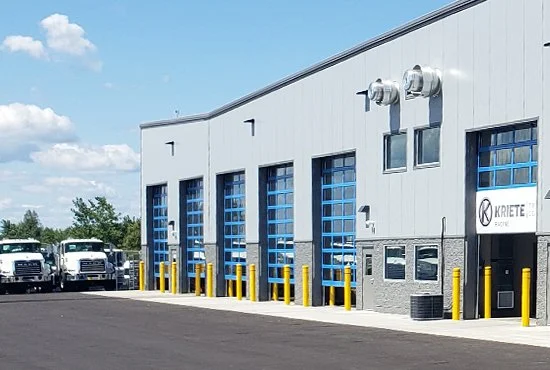 Industrial building with multiple garage doors constructed by Redhawk Metal Buildings in Wisconsin