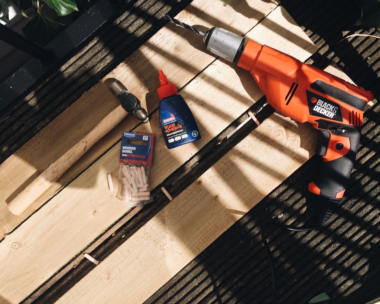 To make the planter base, lay the wood face down and decide on your measurements for the depth and width of the planter, then join with dowels and wood glue.