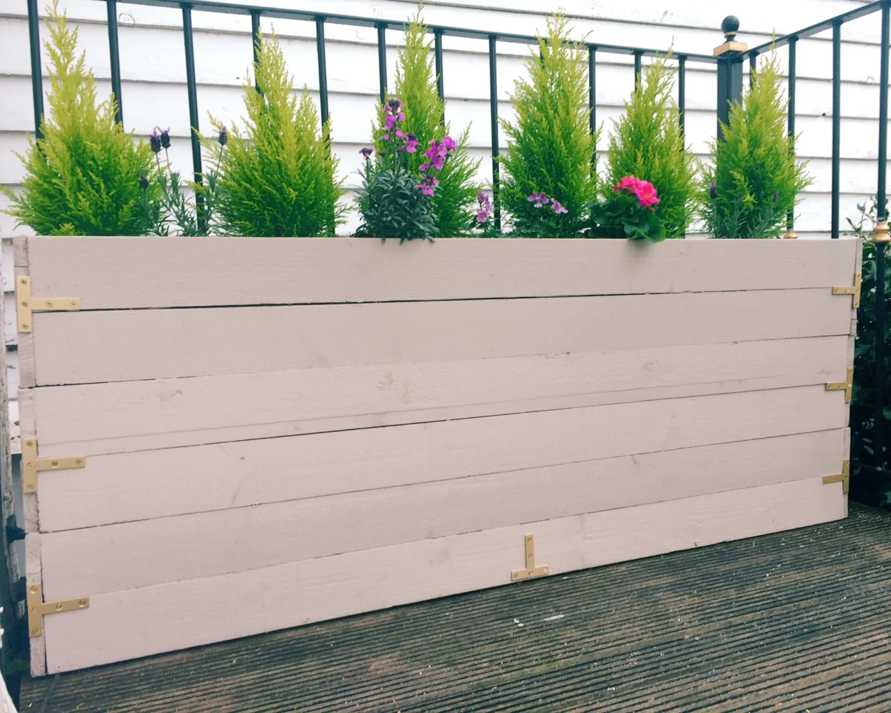 This planter is painted in Cuprinol Garden Shades 'Muted Clay'
