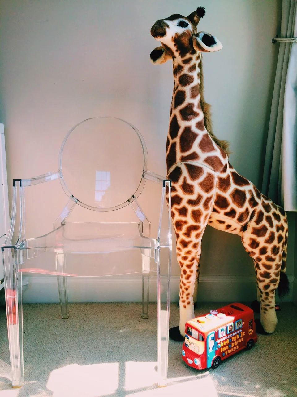 This is the Louis Ghost Chair by Kartell. And Geoffry the giraffe.