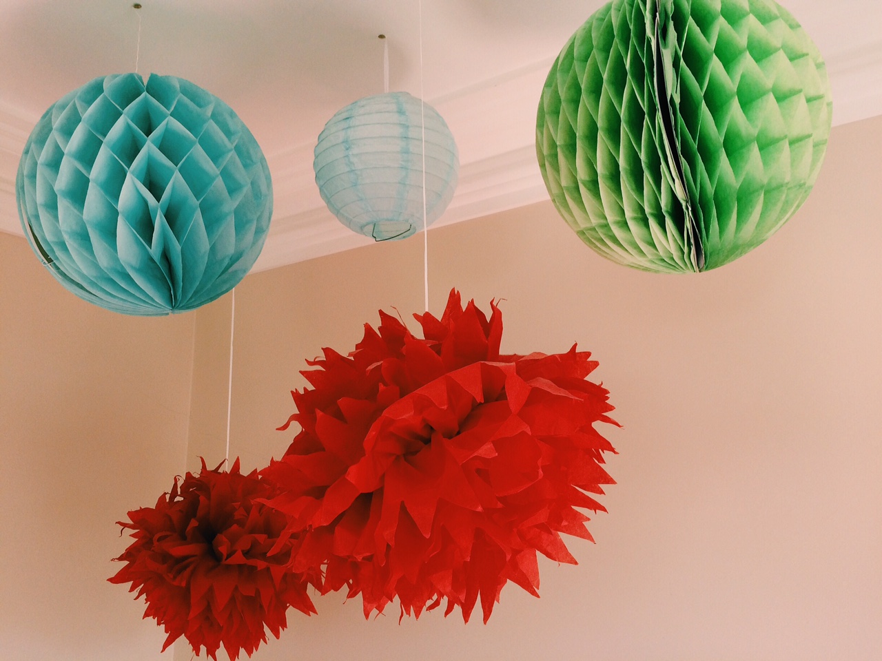 Pom Poms and lanterns by The Hanging Lantern Company.