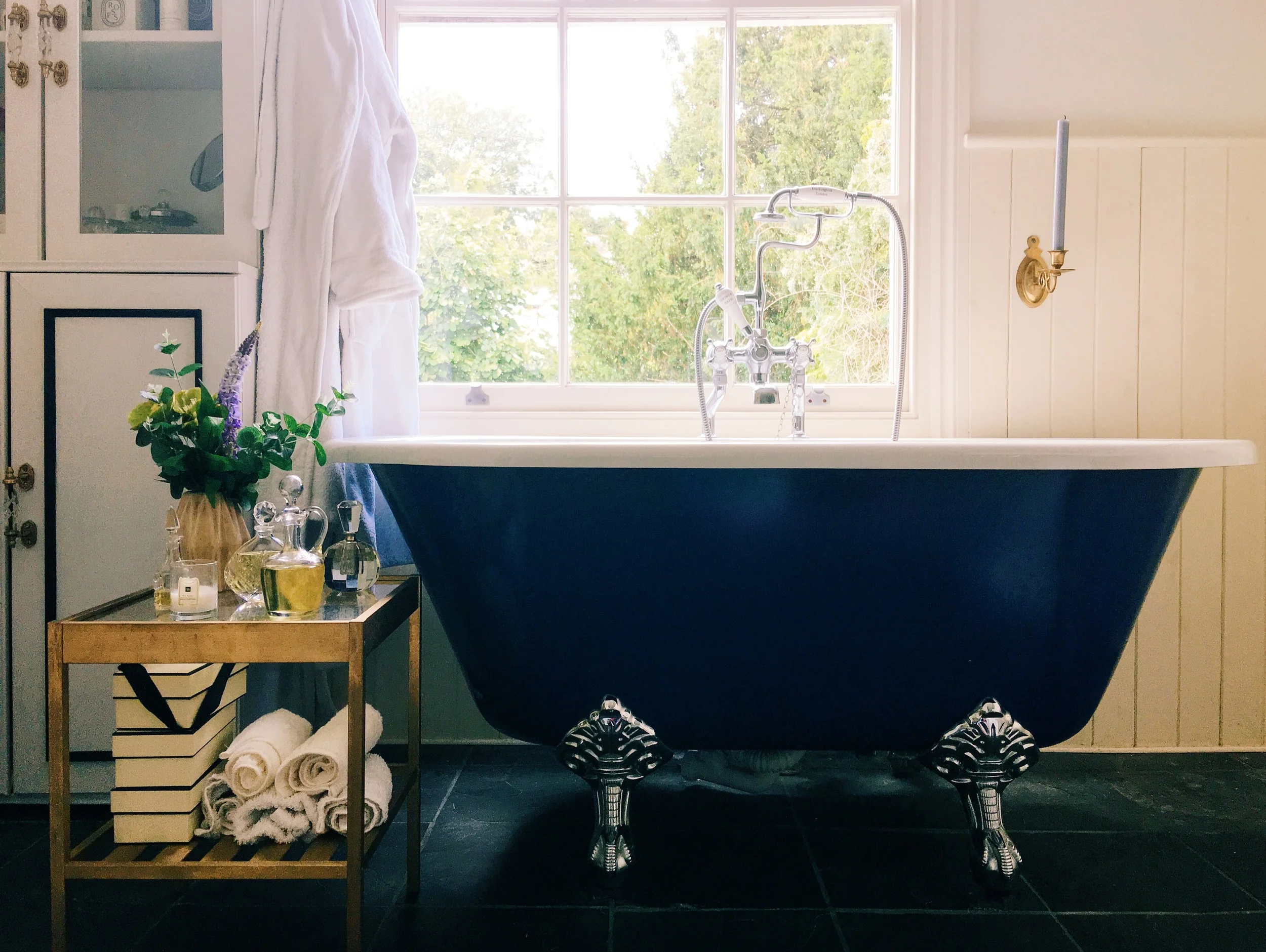 My bathroom at home, with Ikea-hacked cabinet and bathroom table .