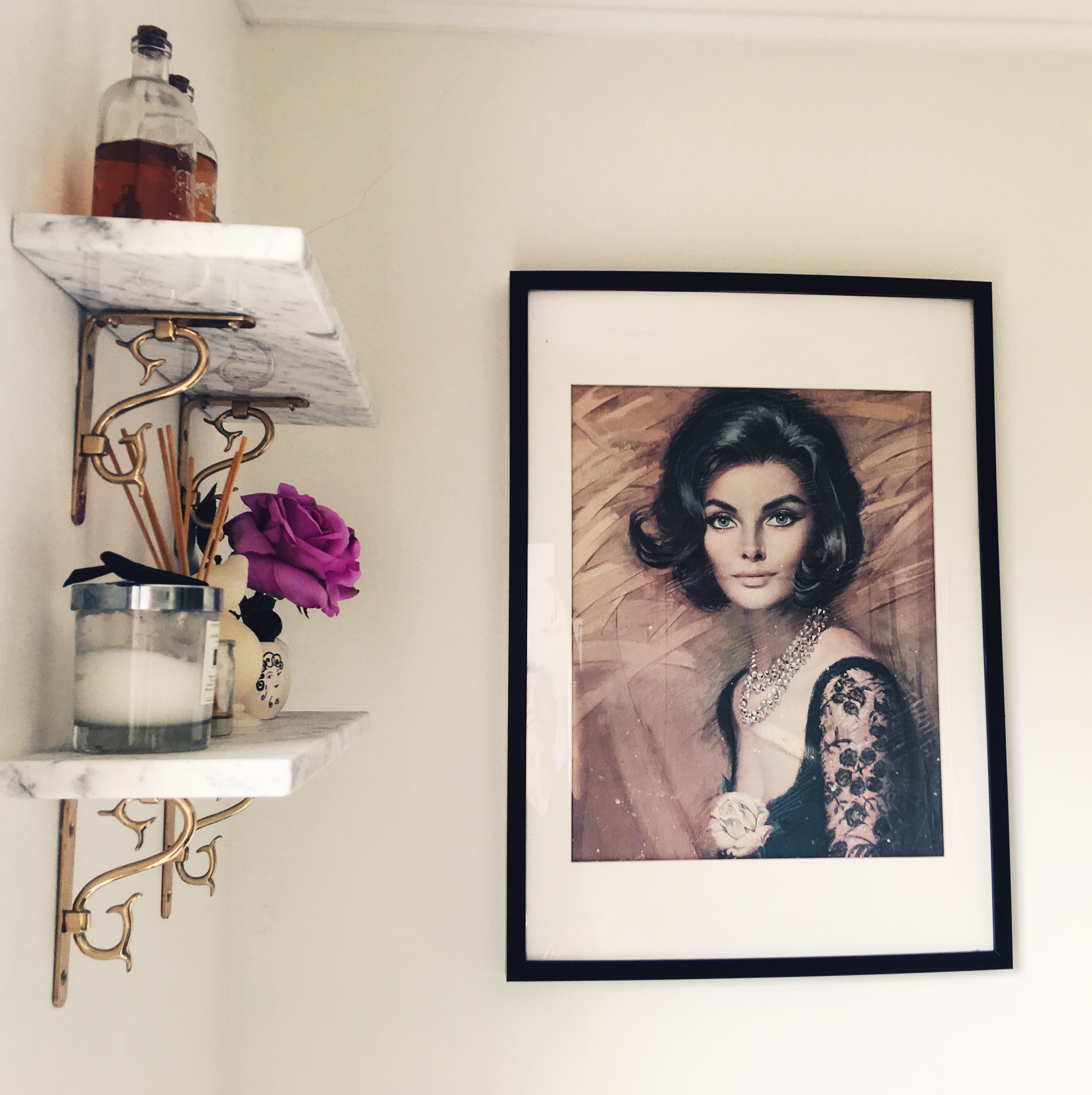 I have vintage art in my bathroom that i've collected from flea markets over the years. The black frame and white mount match my Ikea-hacked bathroom storage unit.
