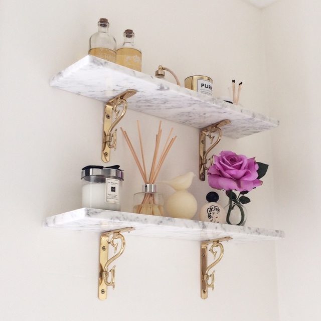 These shelves are real marble that I had made by a local stonemaker, but you can also create the marble shelf 'look' by using contact paper . The brackets are by House Of Brass .