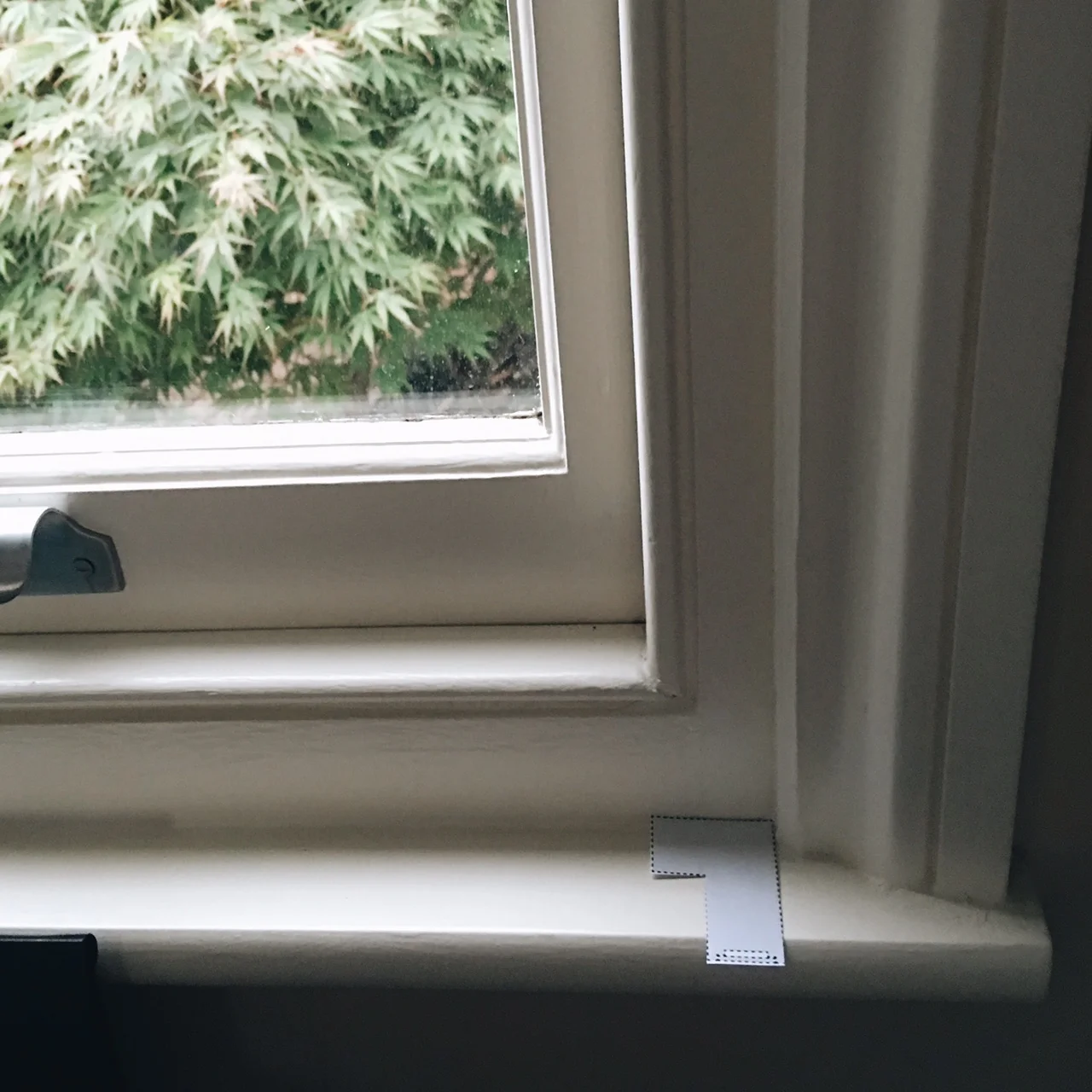 Using the cut out templates available on the website to measure my windows for the shutters.