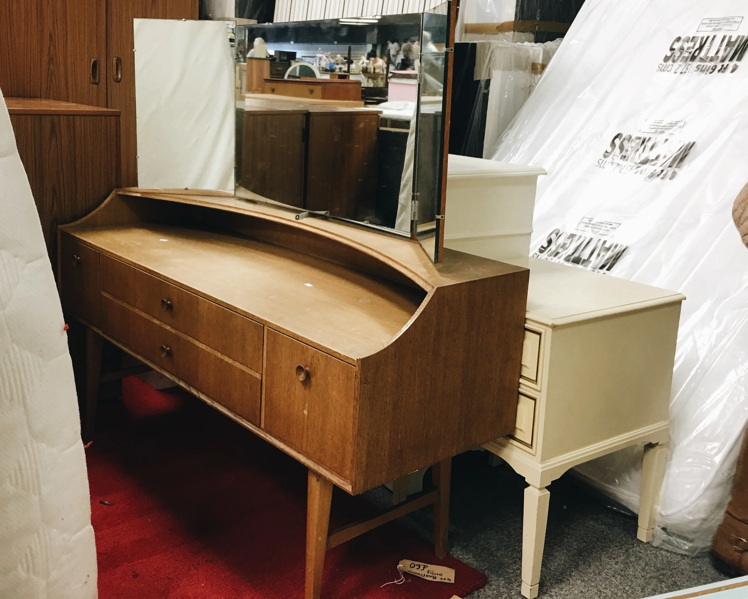 This lovely mid-century modern style dressing table was hiding behind a mattress.