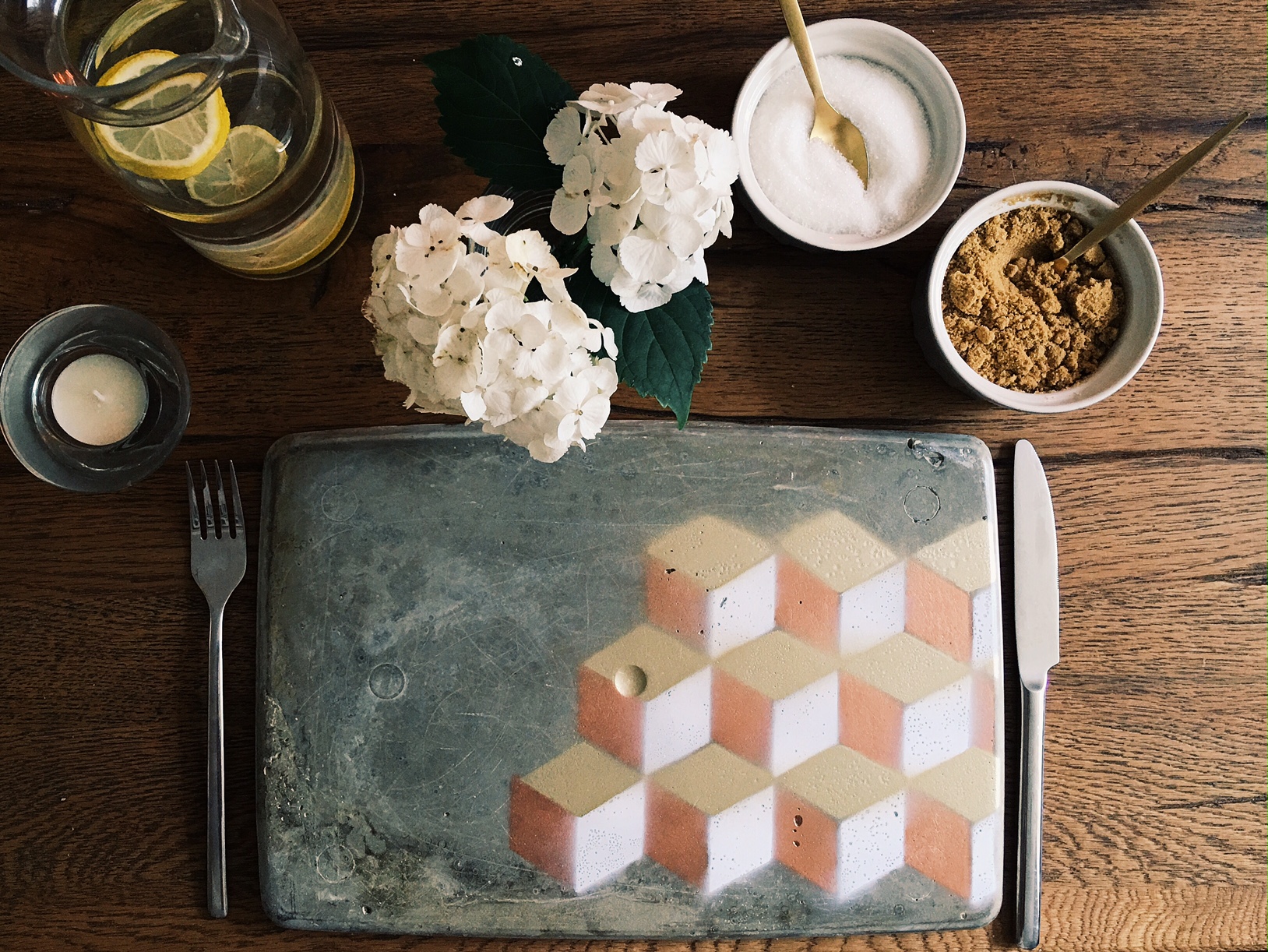Hand made from start to finish - concrete place mat with spray painted geometric pattern