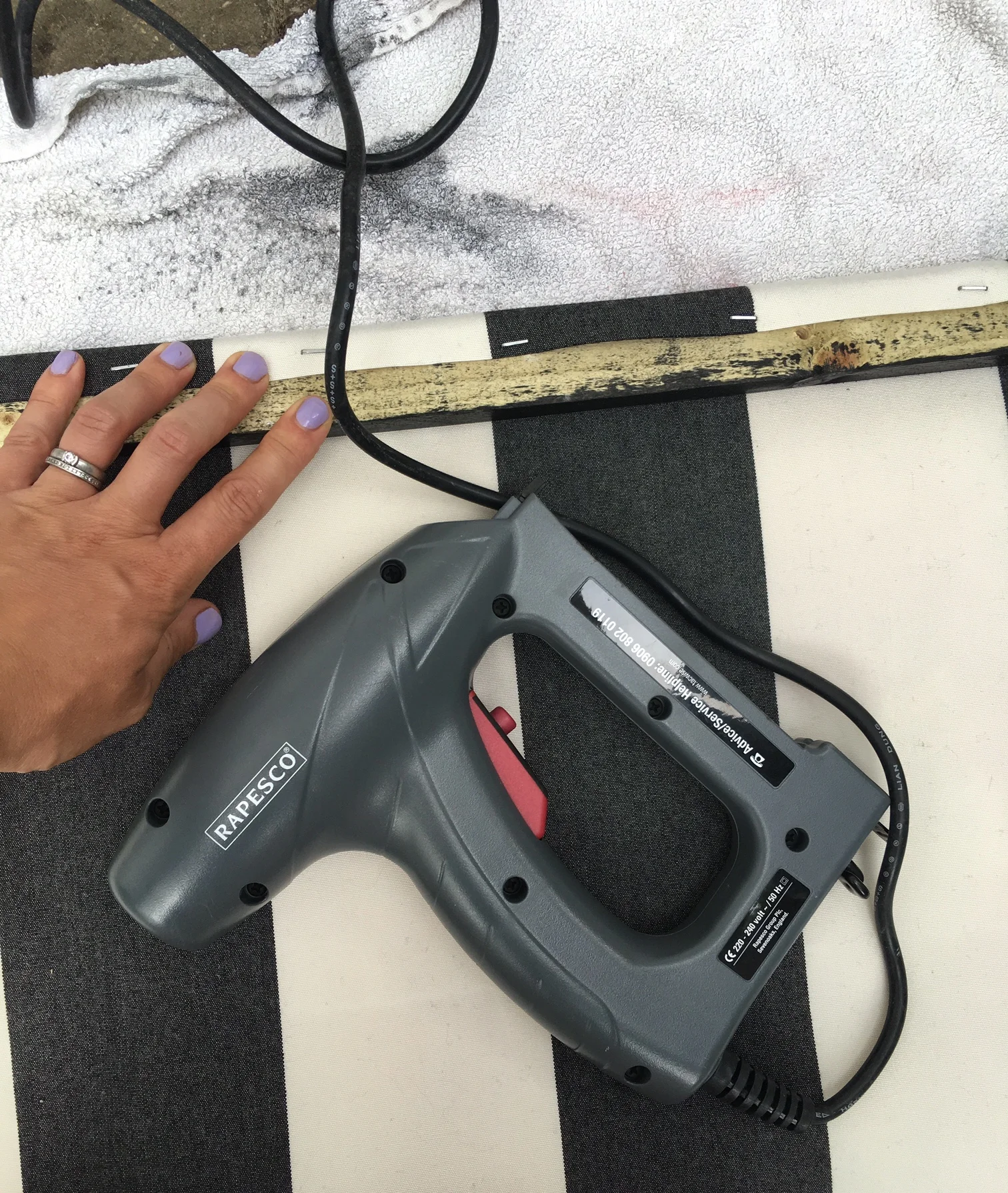 Position the fabric so it just folds over the top of the wood and staple it in place.