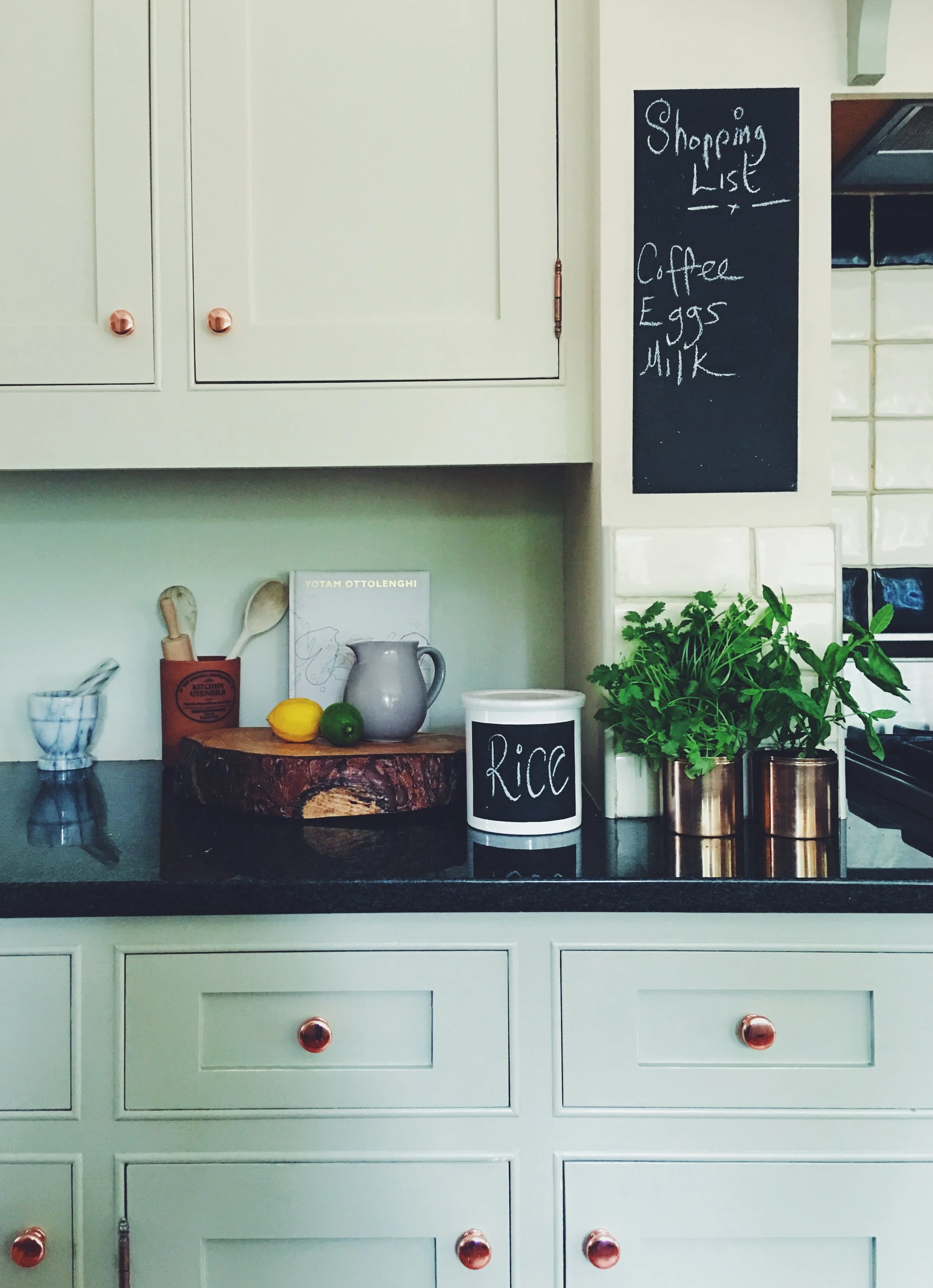 I've used inexpensive chalkboard paint a lot in my kitchen. I've used it to label food pots, and created a shopping list area on an otherwise unused bit of wall.