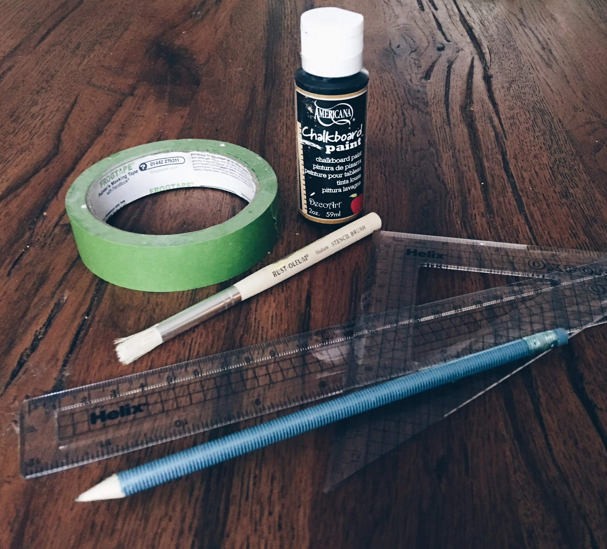 You will need: Small pot of chalkboard paint, Frog Tape, small paintbrush, pencil, measuring equipment.