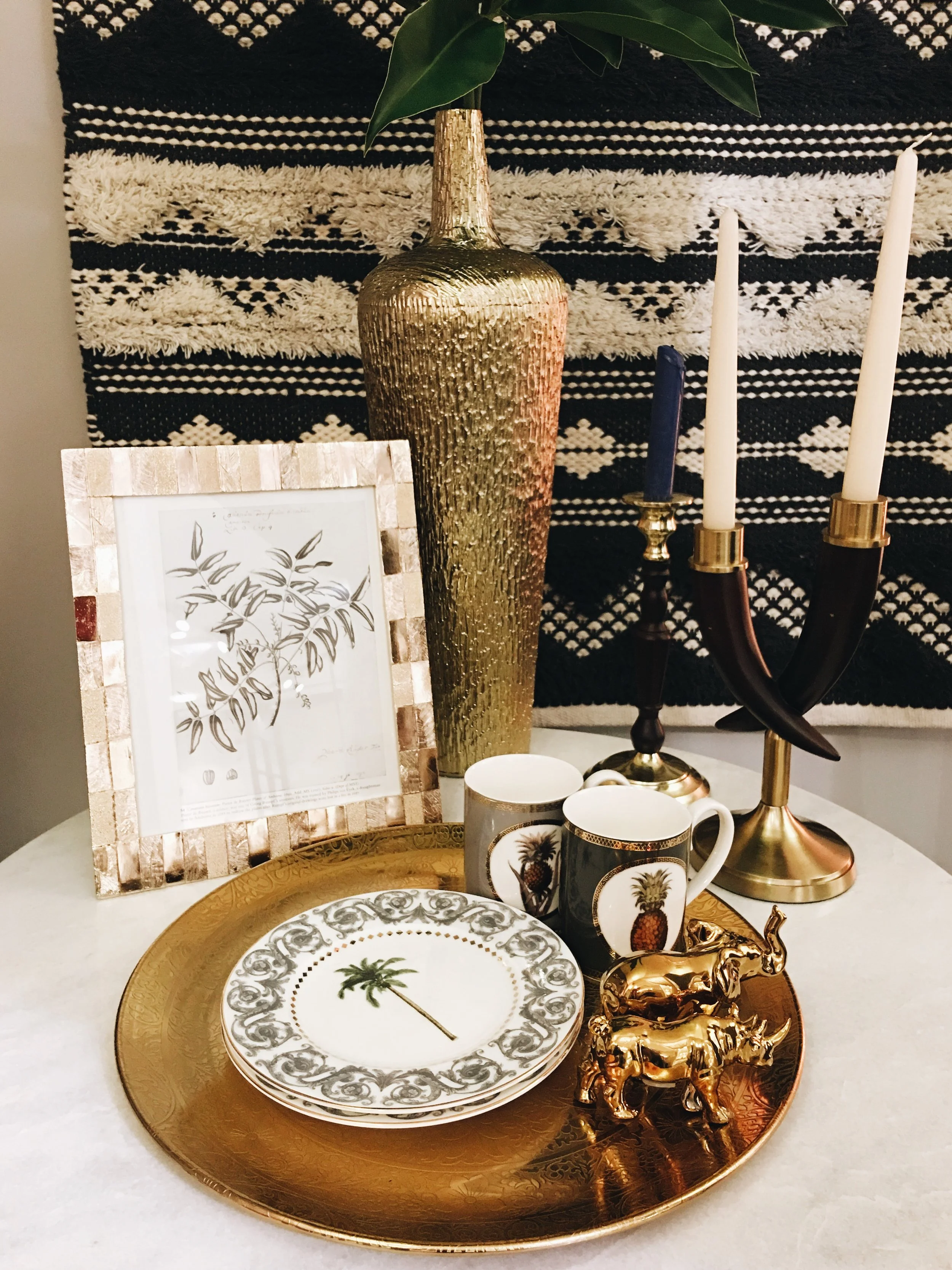Palm trees and pineapples are given a more sophisticated edge at M&S for SS17. Mugs, £6. Tall Afia Vase, £39.50. Wood and brass candle stick, £17.50. All other items TBC.