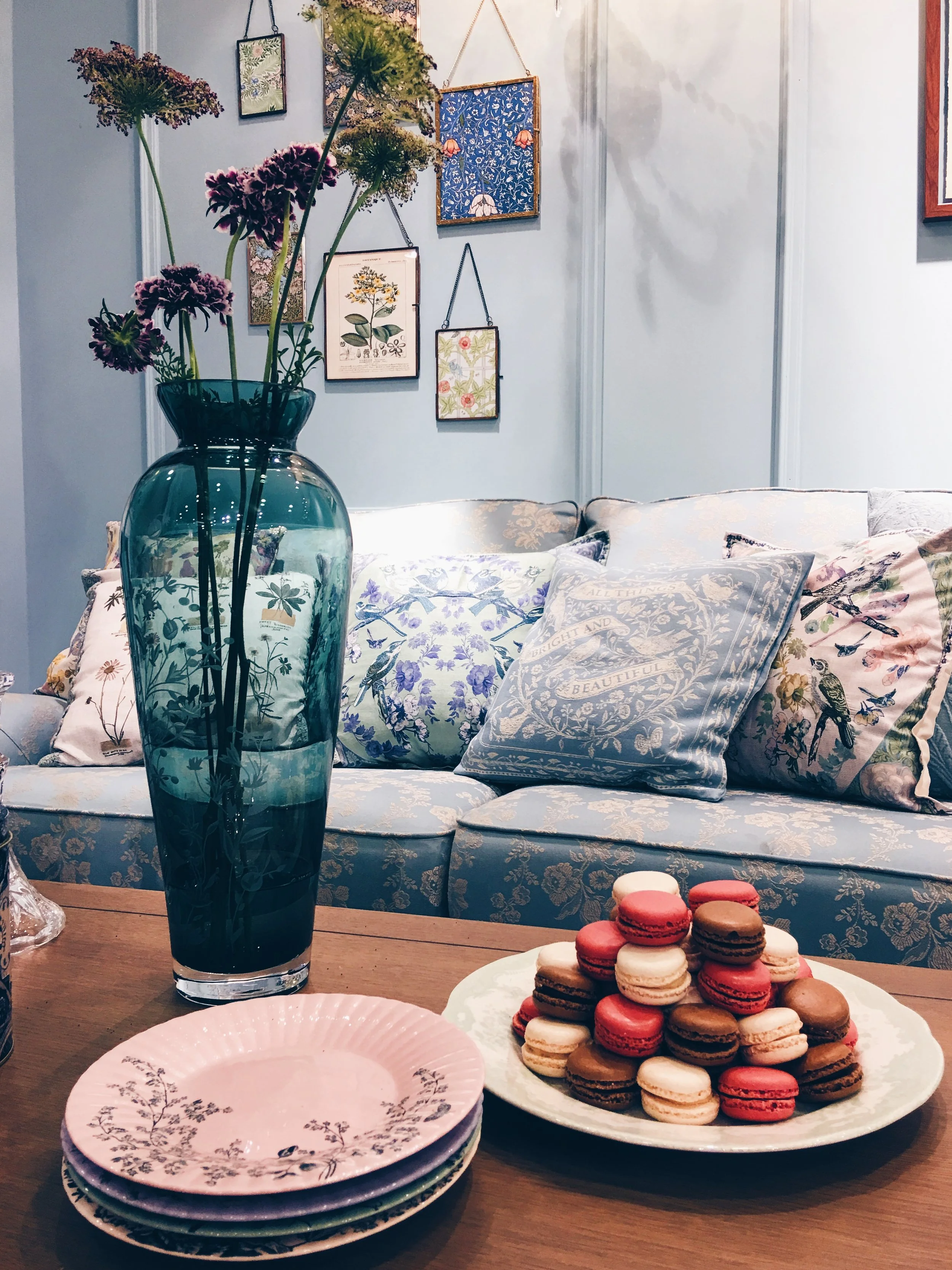 These items made up the M&S 'Soft vintage' collection. Georgia sofa in Blue Floral Jacquard, £1399. Vase & plates, price TBC. Cushions, from a selection, £25 each. William Morris prints and hanging frames, from £12-£25. All M&S.