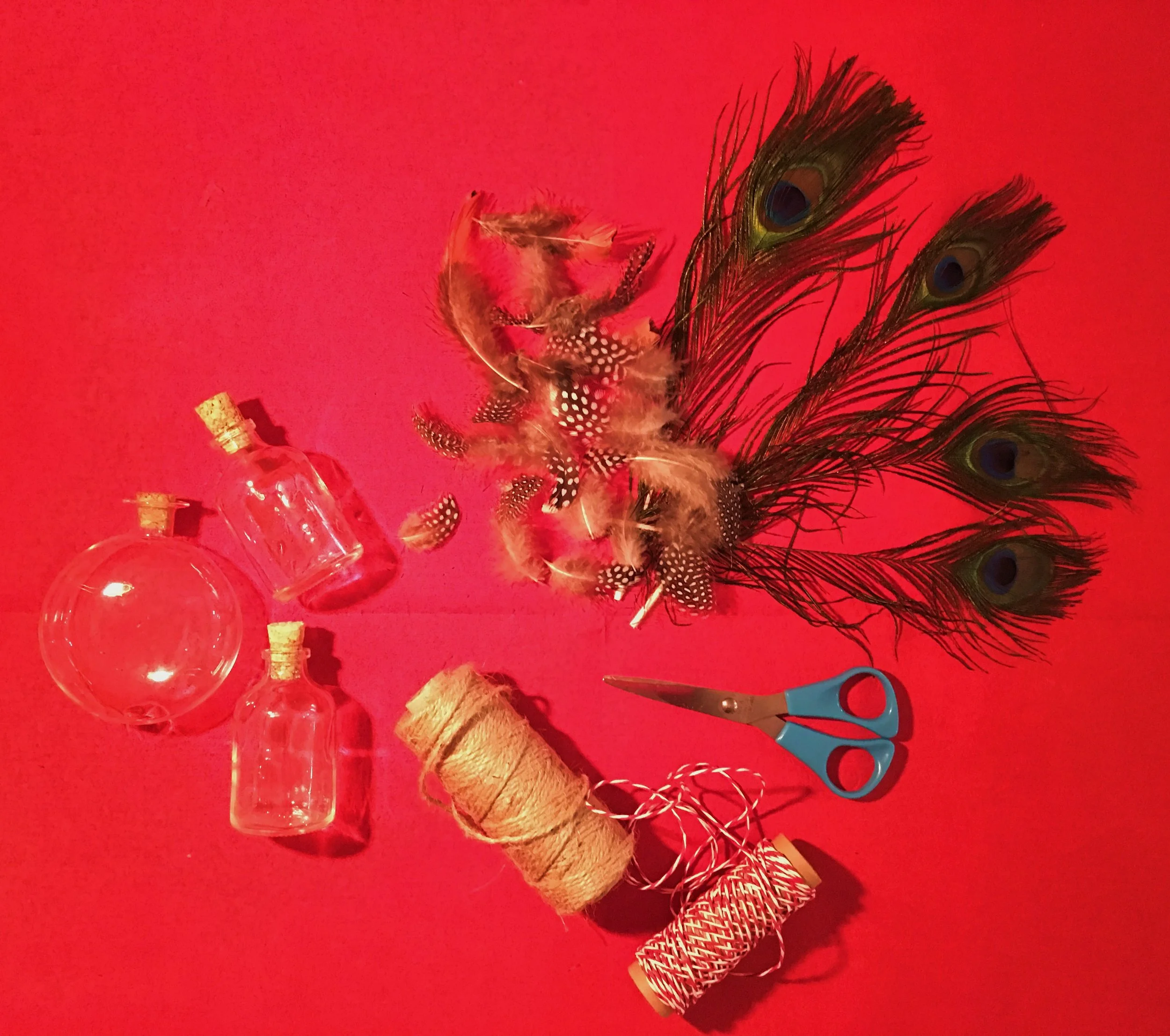 You will need: 50ml glass bottles with cork lids, feathers, scissors, twine/string.
