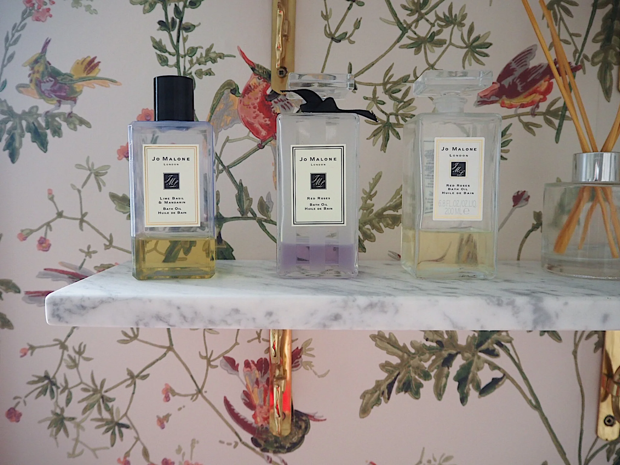 I've displayed luxurious bath products to make the bathroom feel more 'special'. Buy Jo Malone bath oil from John Lewis.