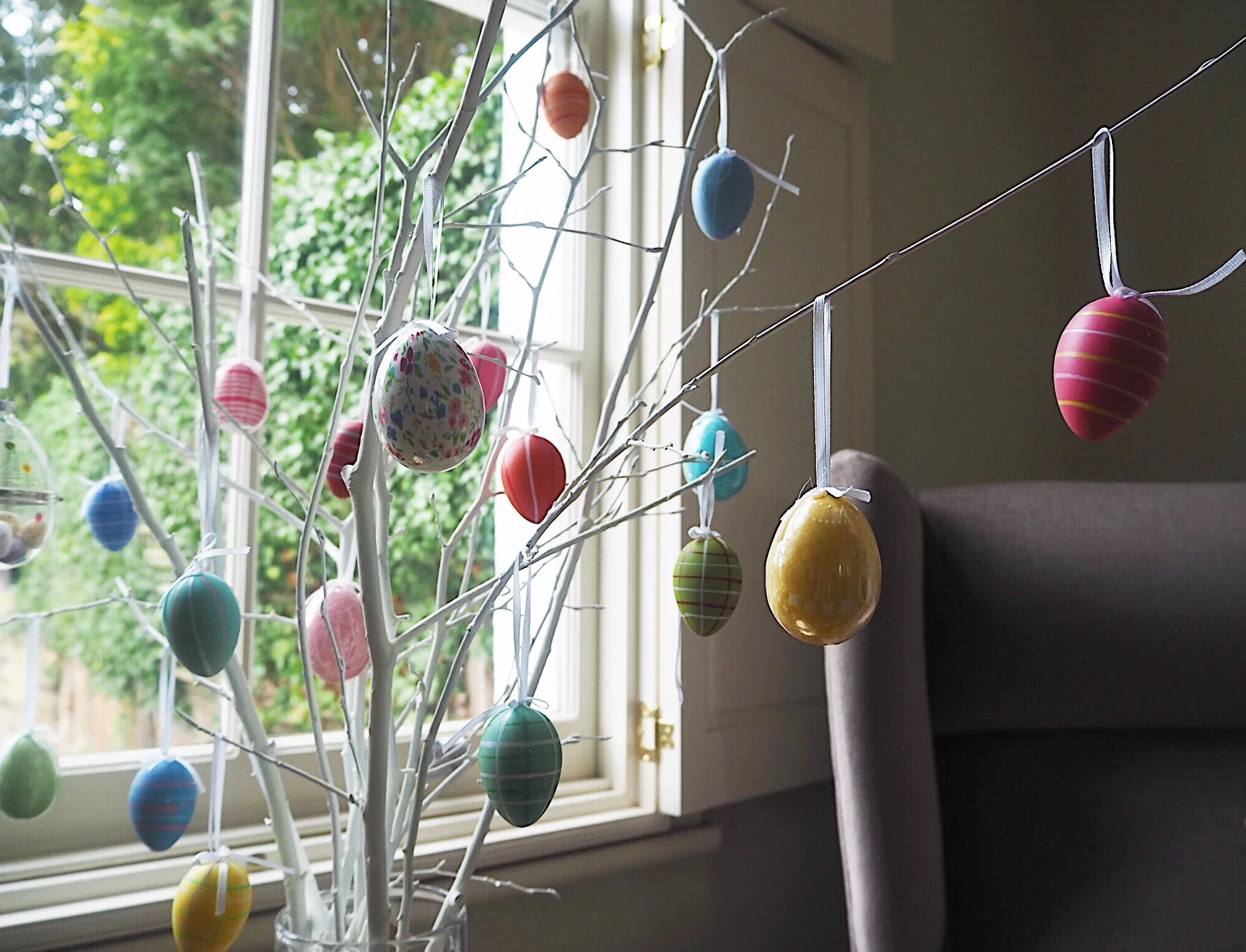 Create A Pretty Easter Display With Painted Branches & Hanging John