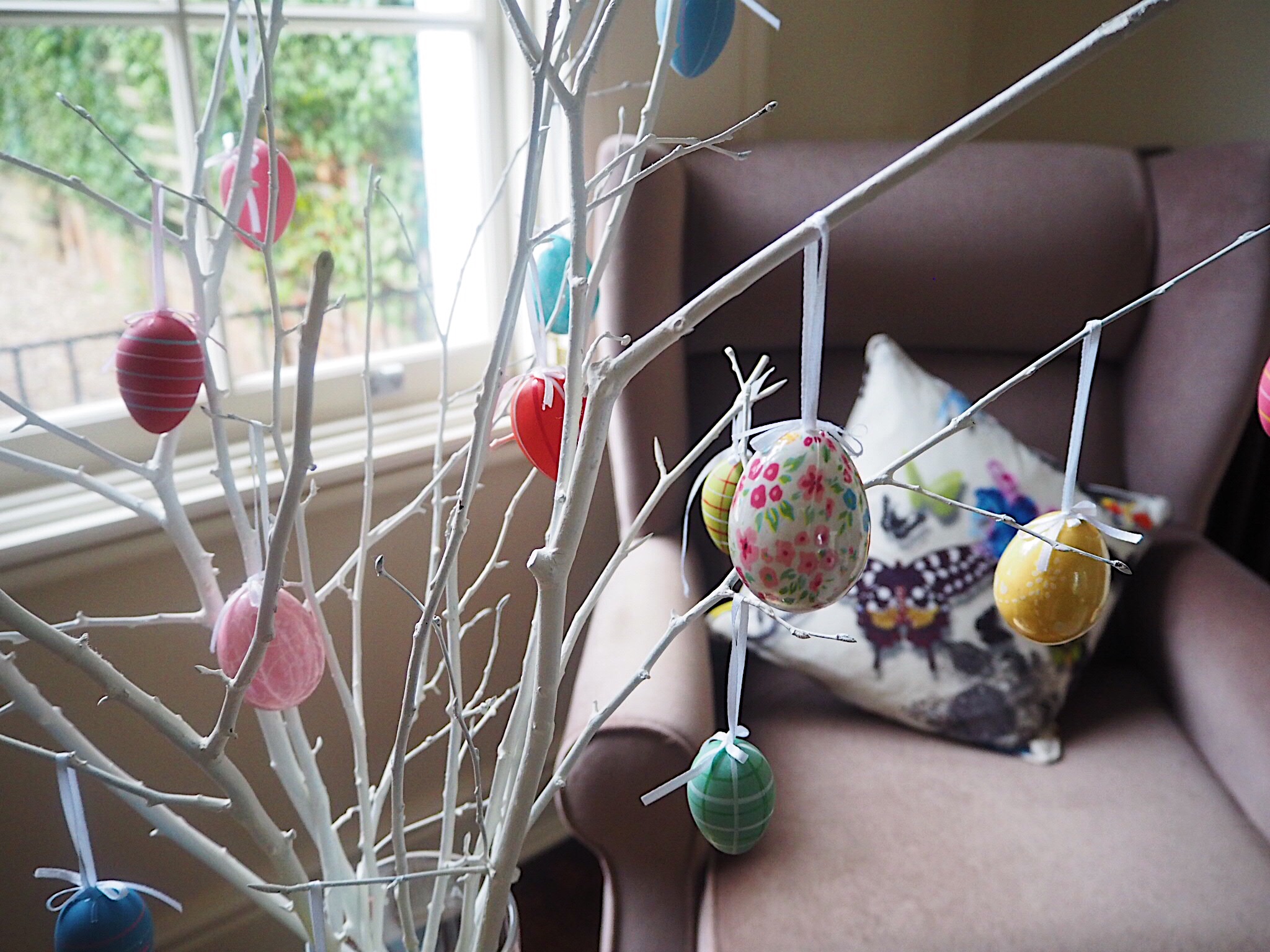 Create A Pretty Easter Display With Painted Branches & Hanging John