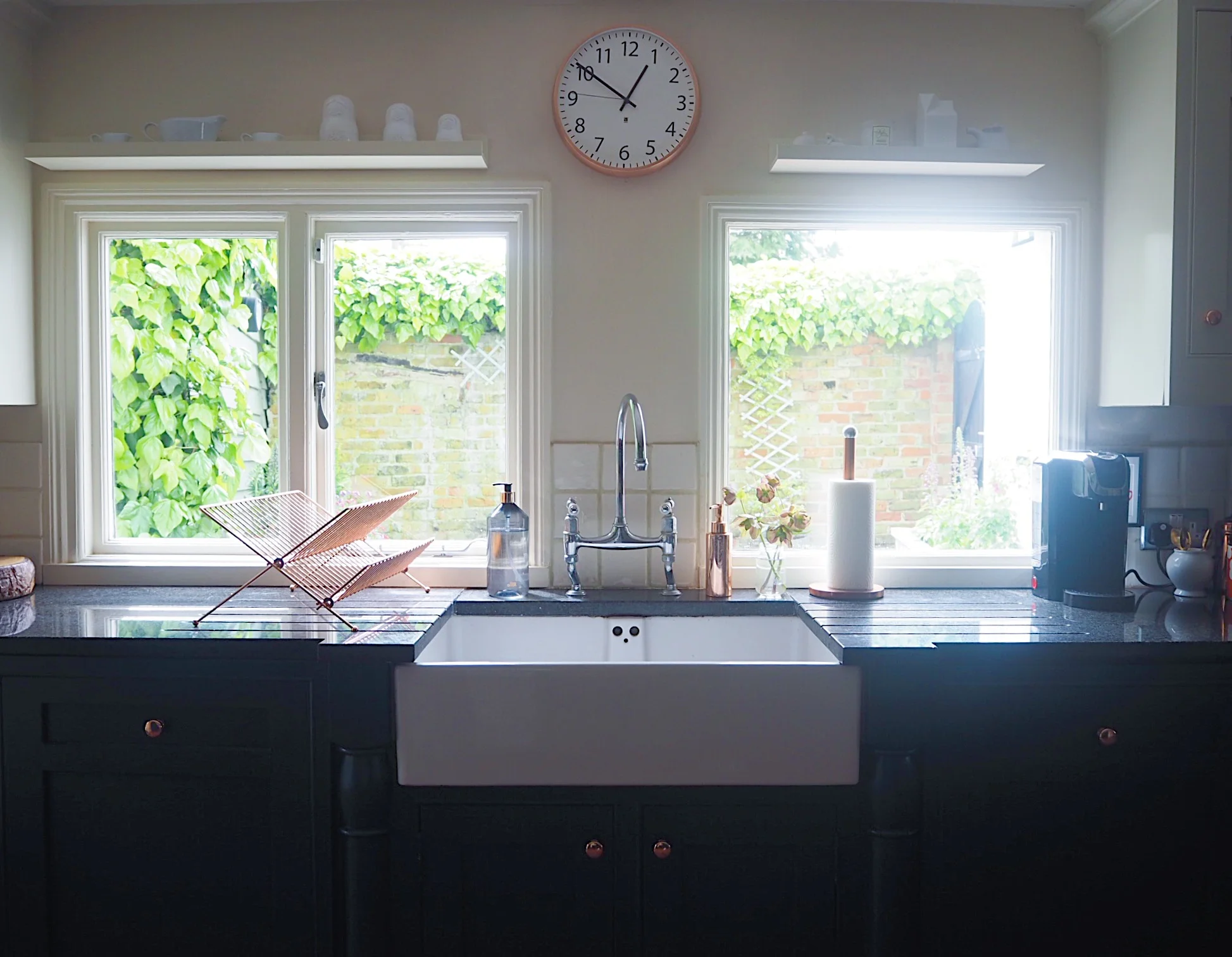 I put up IKEA picture rails that I cut to size to make the most of the space above the windows. The copper clock was purchased in Homesense.