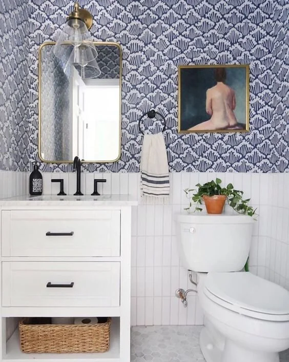 If you inherit a rather plain, sterile, white bathroom, wallpaper can really give it colour, pattern and vibrancy. Image Credit: @sunnycirclestudio on Instagram.